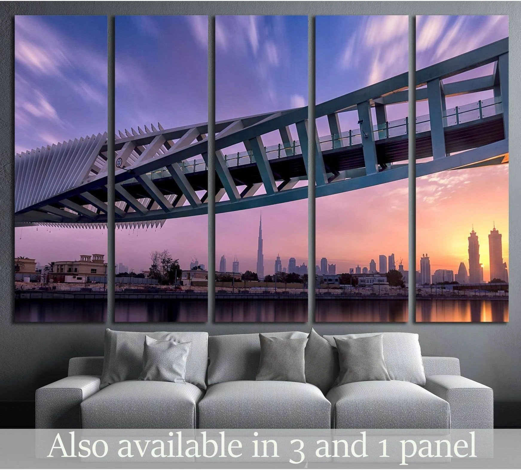 Dubai skyline canvas print with canal bridge and Burj Khalifa at sunrise above a gray sofa