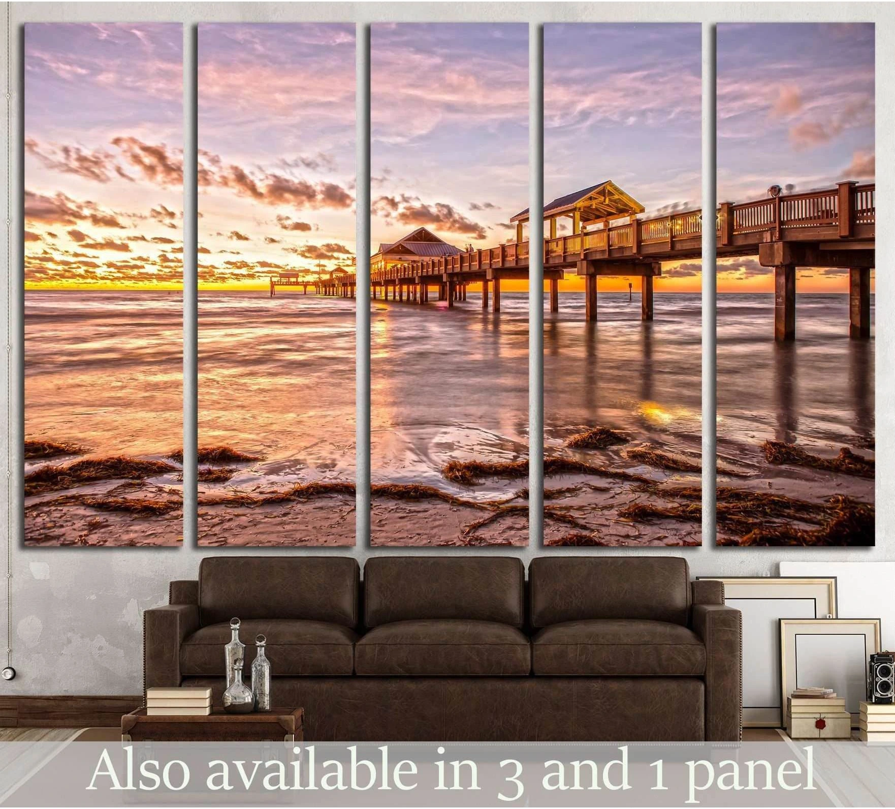 Clearwater Beach pier sunset canvas print hung above a sofa in a coastal living room mockup