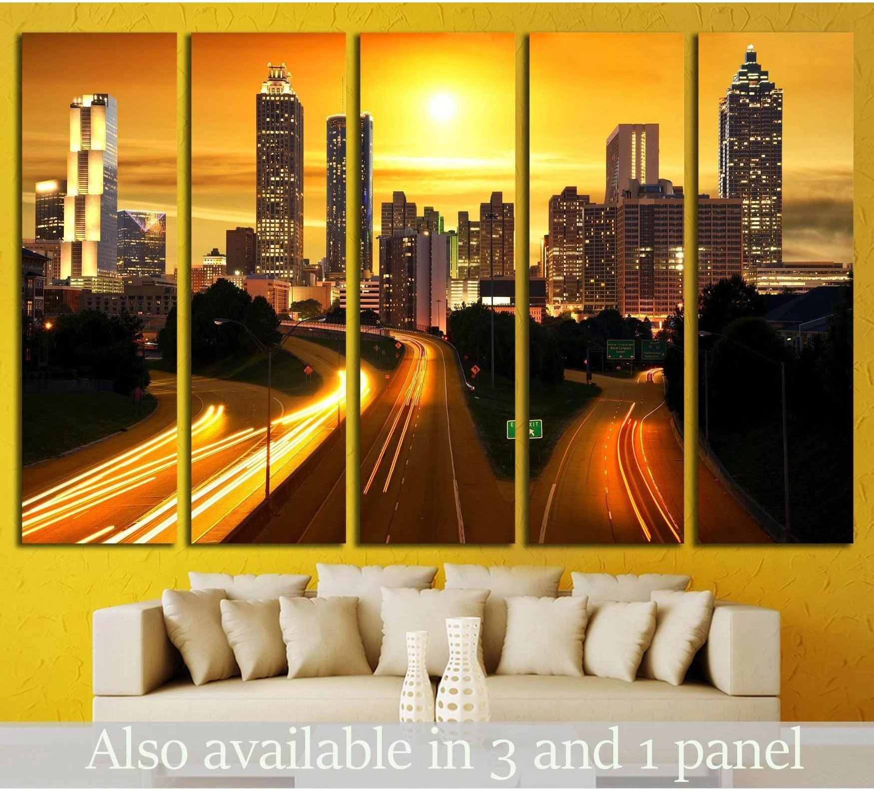 Atlanta skyline canvas print with golden sunset and highway light trails above sofa in living room
