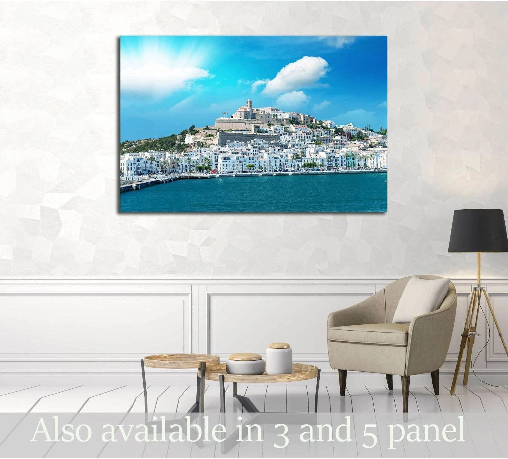 Ibiza port canvas print with white hillside town above blue sea in a modern living room
