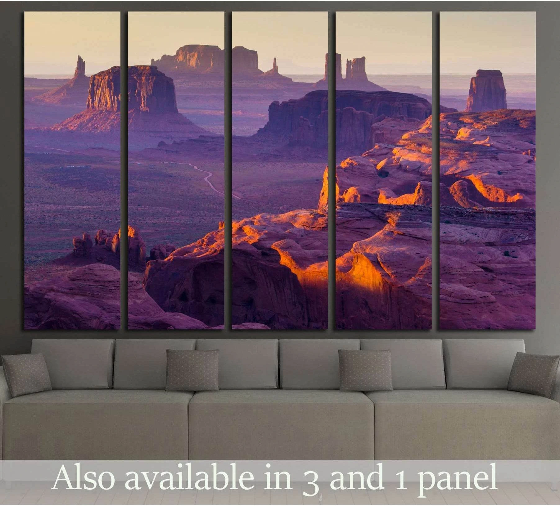 Hunt's Mesa sunset canvas print with panoramic desert mesas in purple and orange tones above a sofa