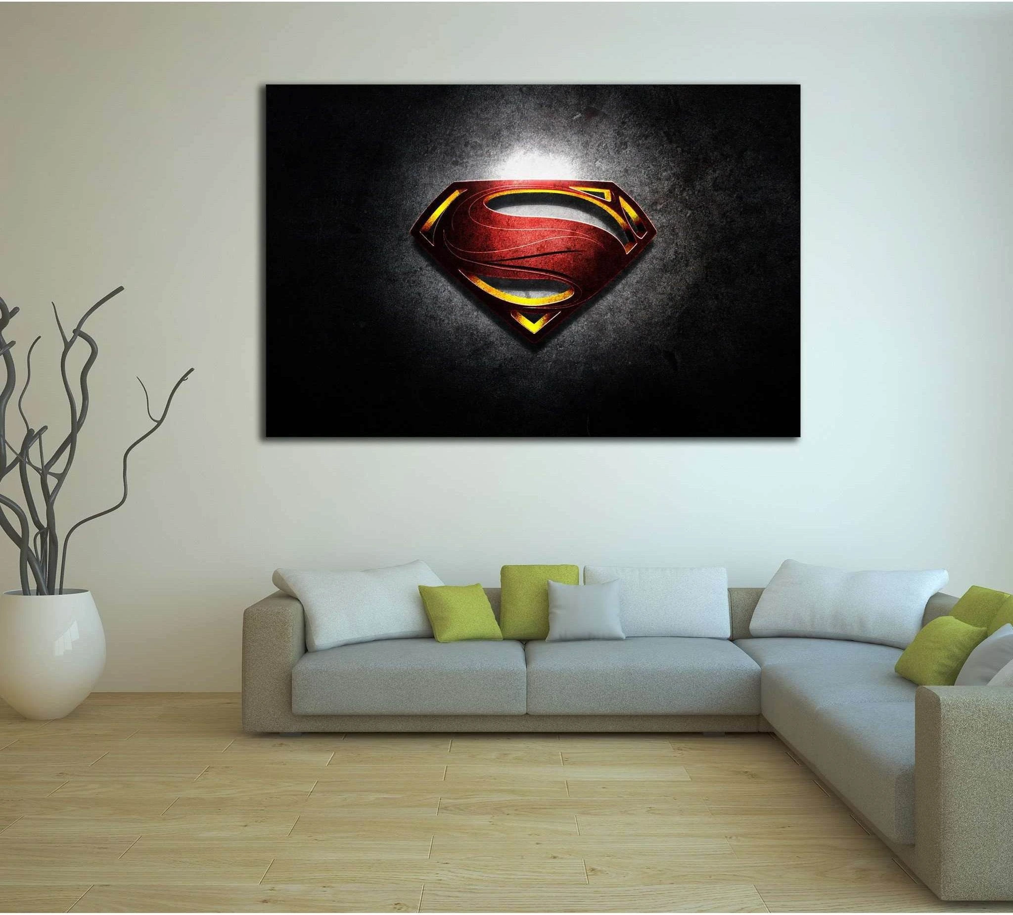 Superman shield canvas print with red and gold emblem on a dark textured background above a sofa