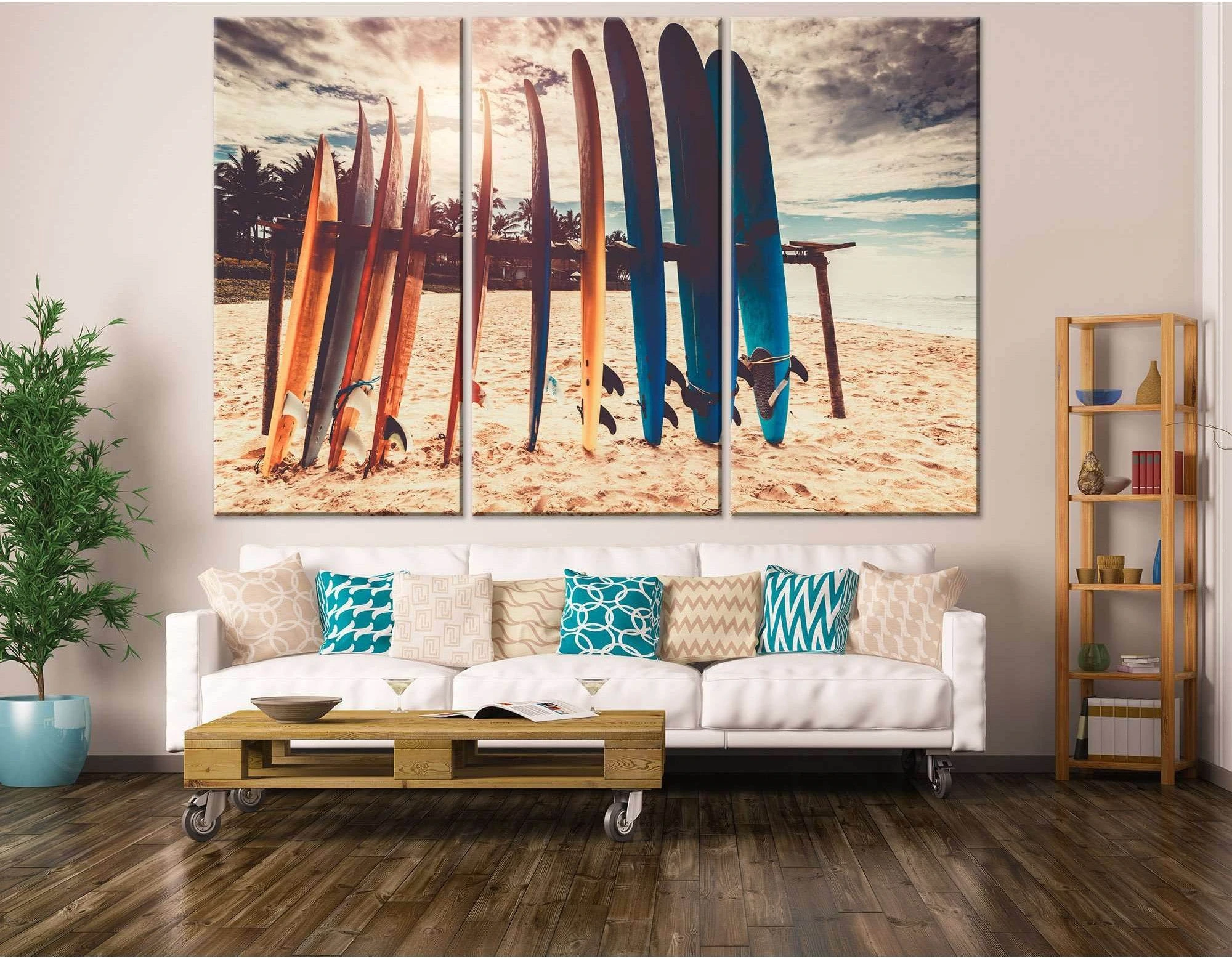 A large, horizontal canvas print of a beach scene with a row of colorful surfboards standing upright in the sand