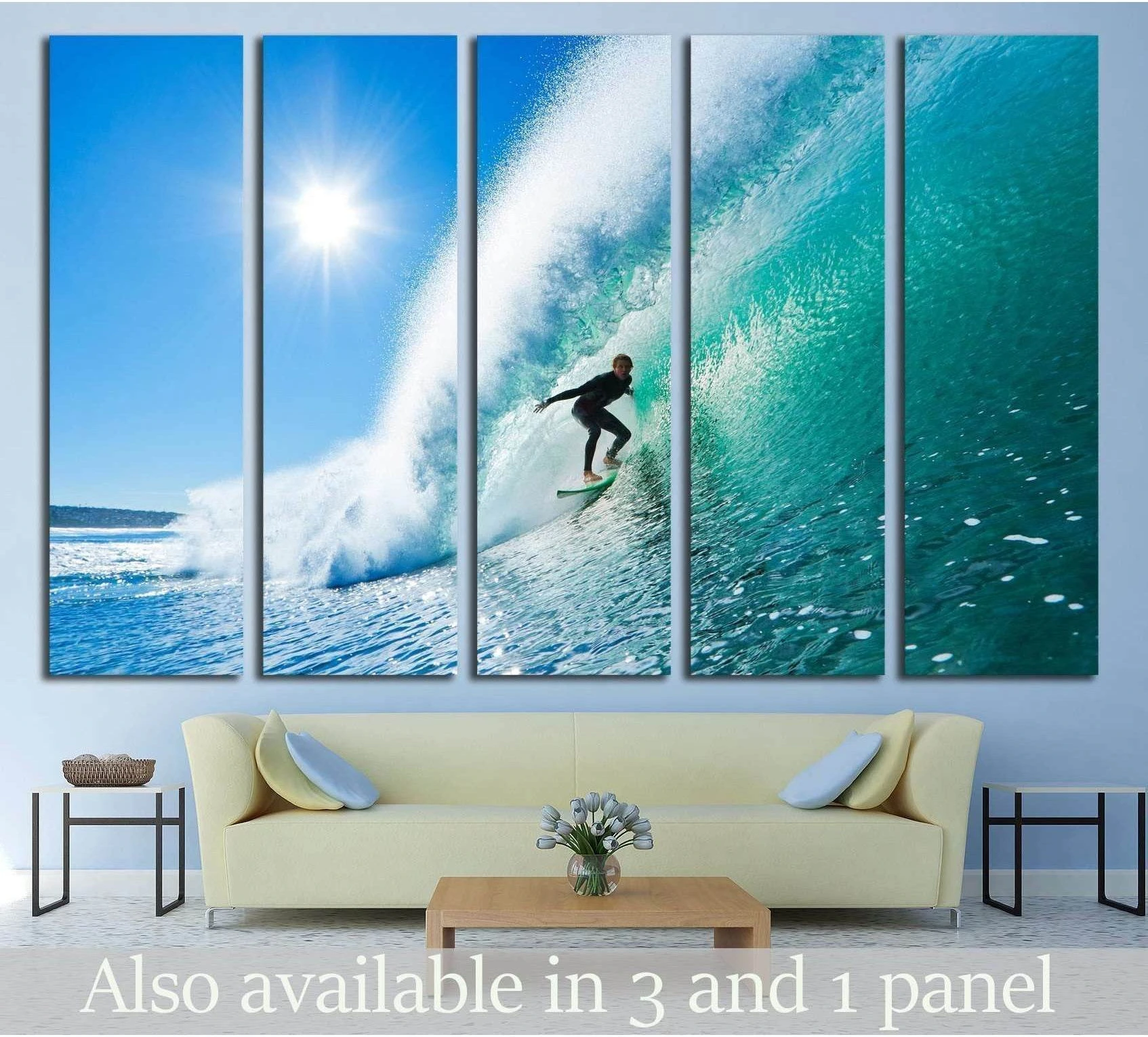 Surfer riding inside a turquoise barrel wave canvas print hung above a sofa in a coastal living room
