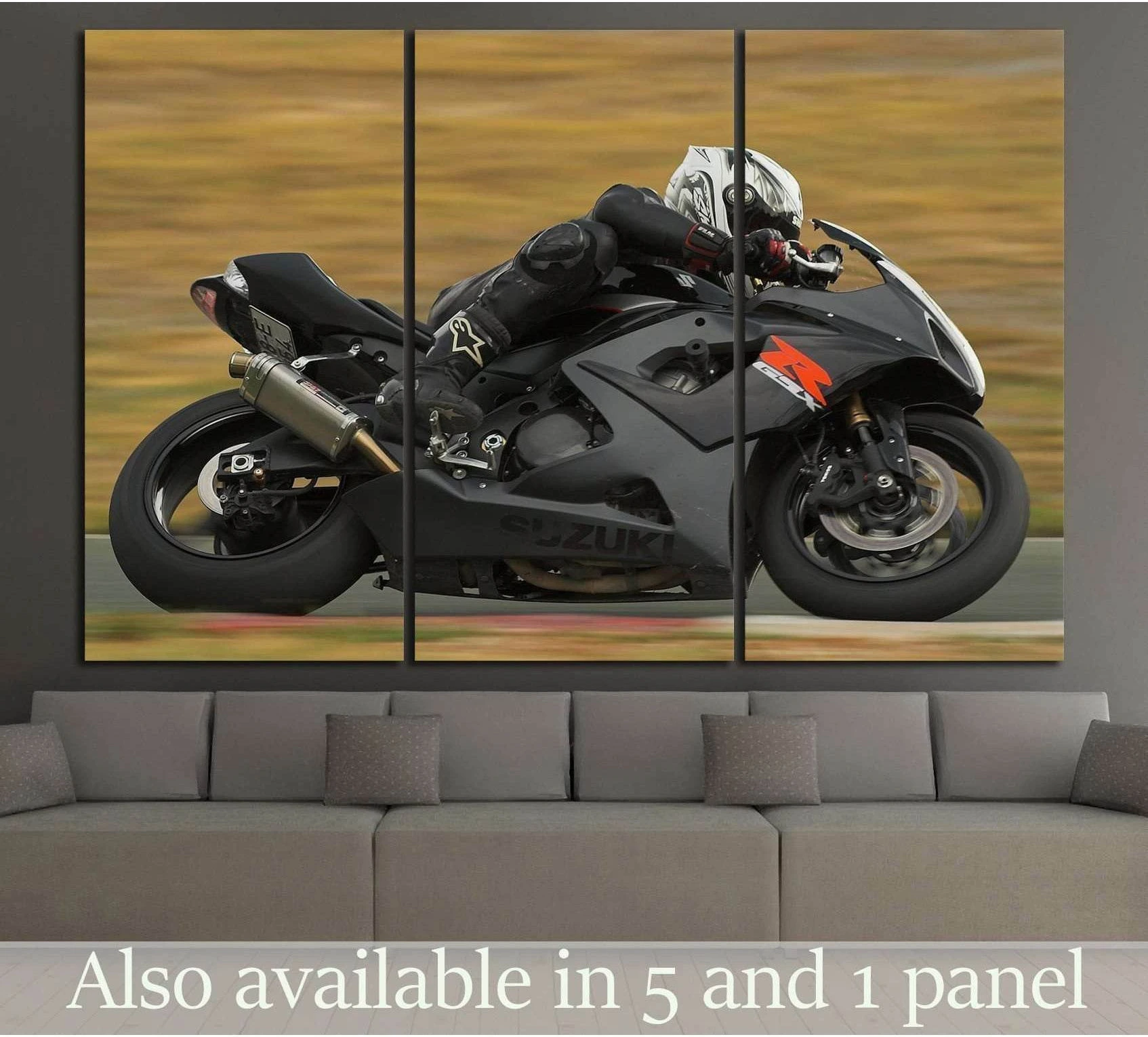 Suzuki GSX-R sportbike canvas print with rider cornering on track above a gray sofa