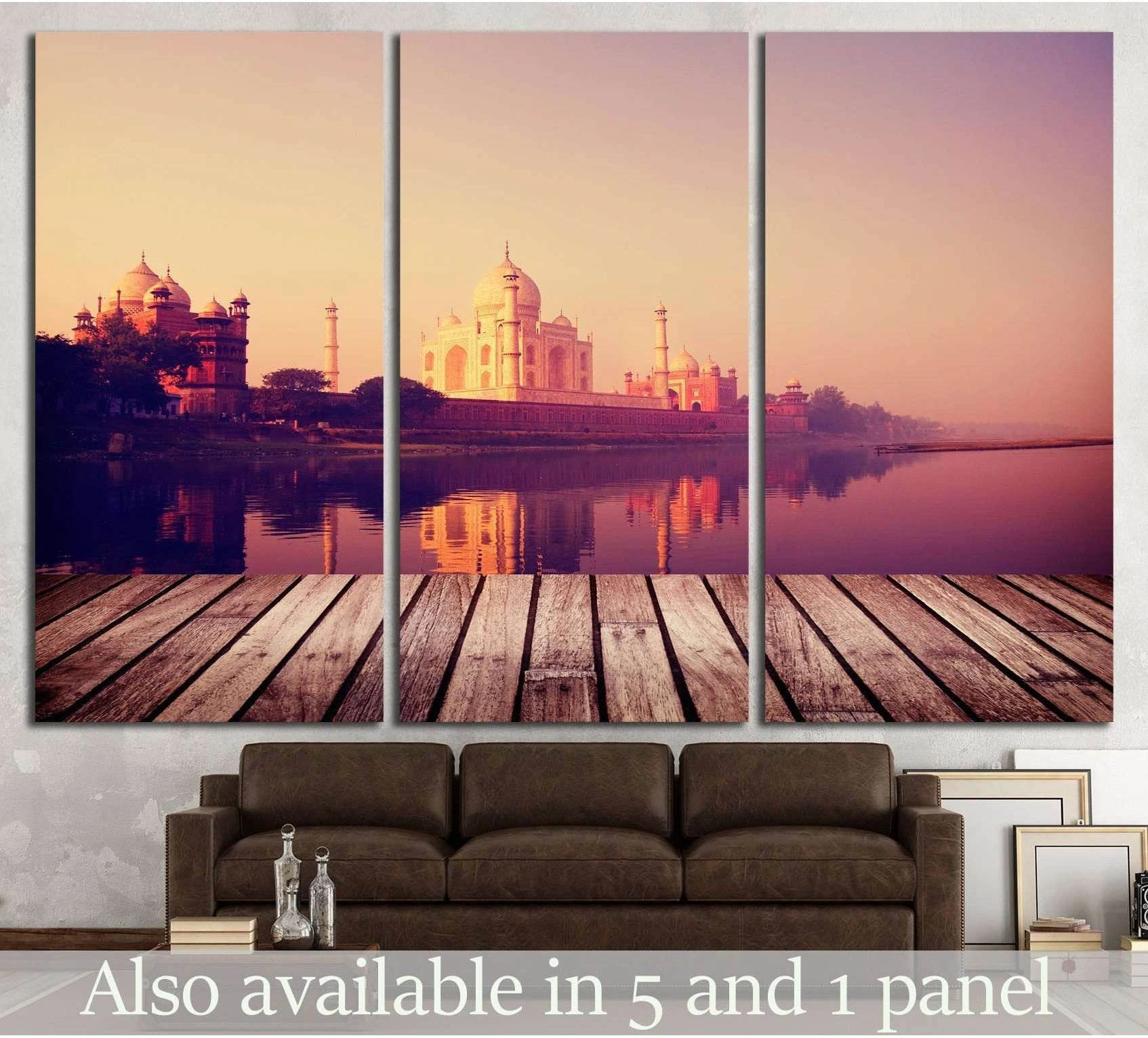 Taj Mahal canvas print in pink-gold sunrise tones displayed as a triptych above a brown sofa