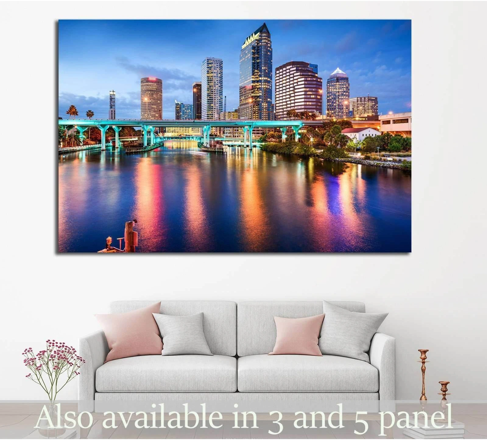 Tampa skyline canvas print above sofa with teal bridge lights and colorful river reflections at dusk