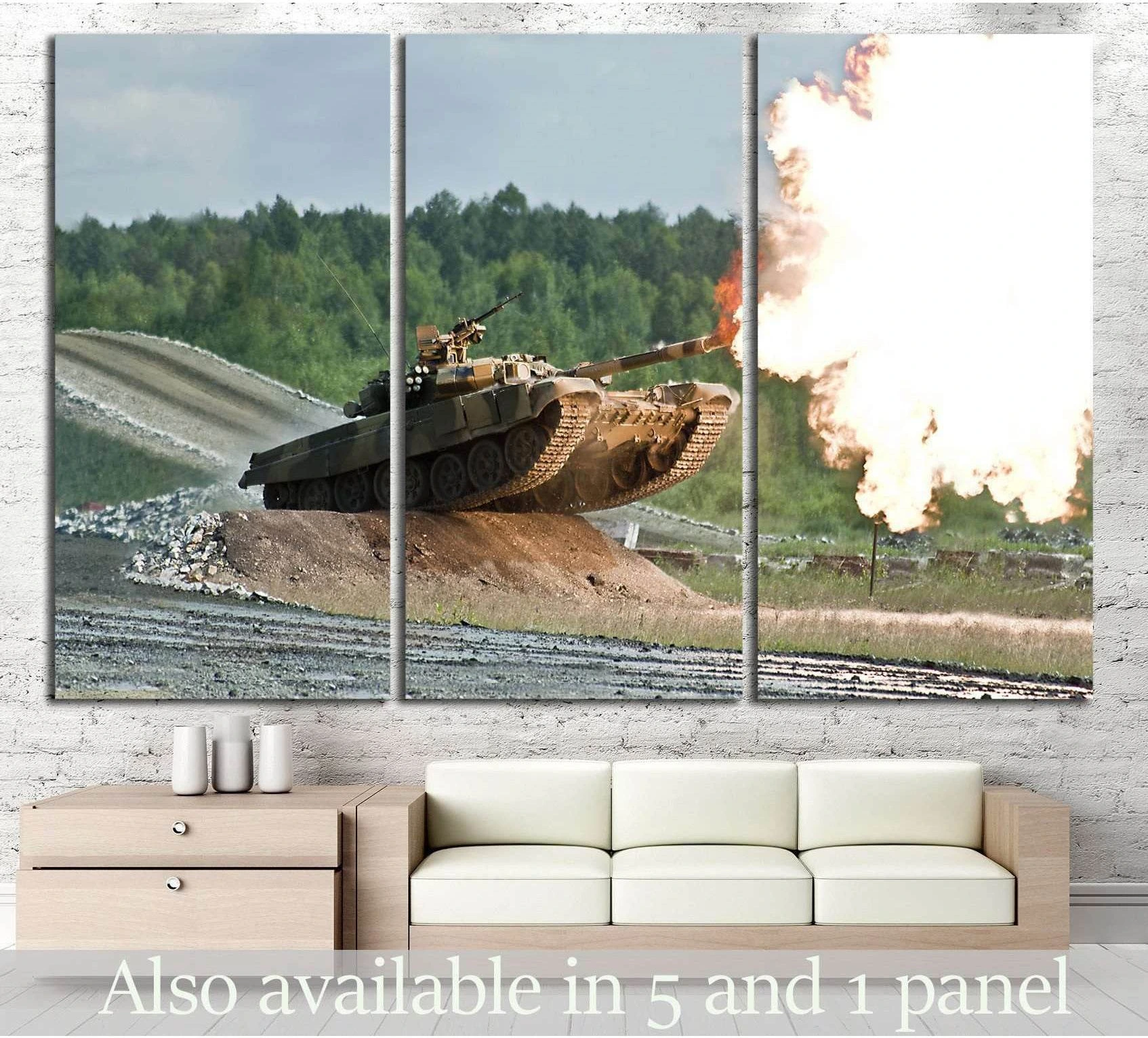 Armored tank firing canvas print shown as triptych wall art above a sofa in a modern living room
