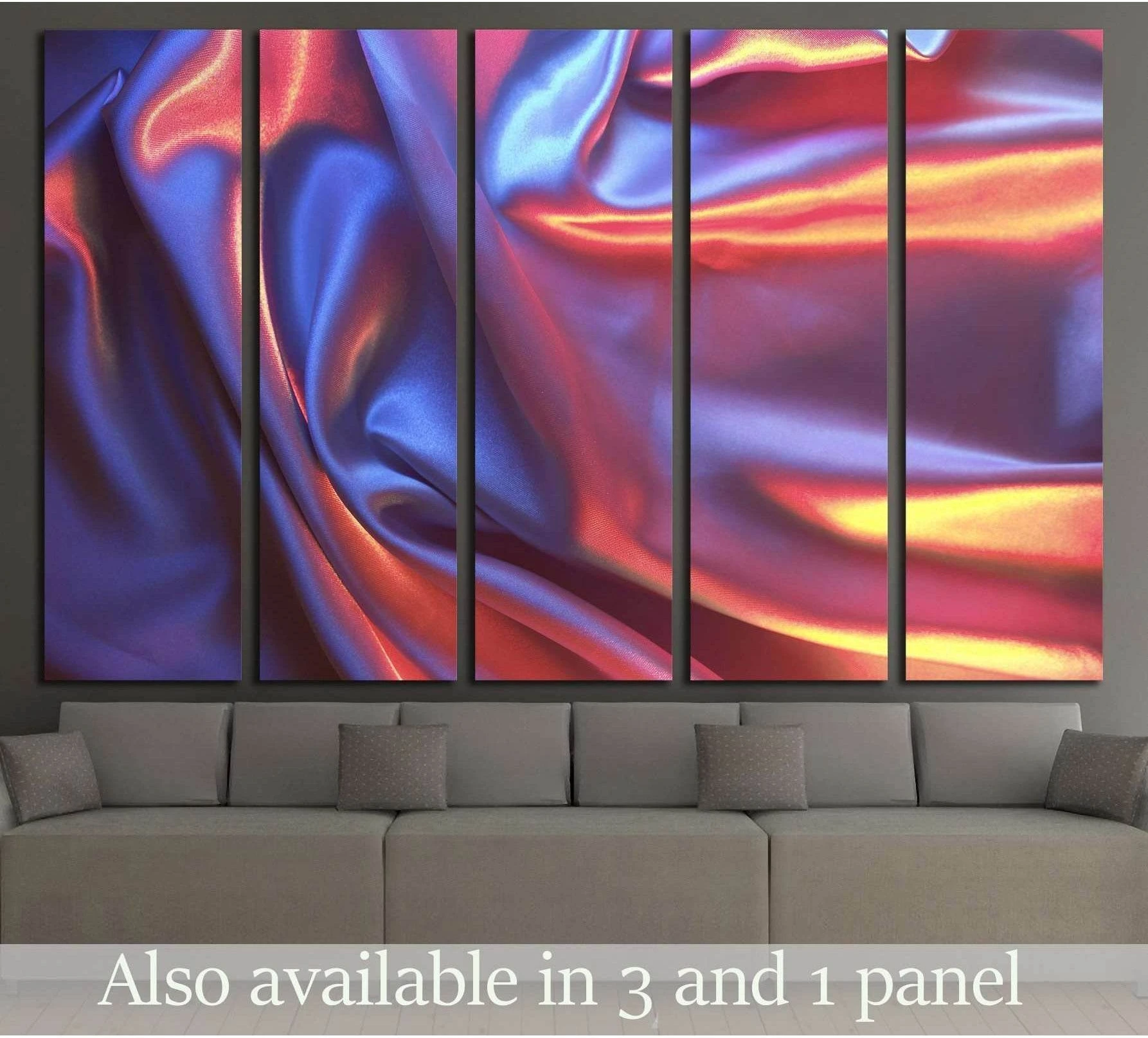 Iridescent satin abstract canvas print with blue, violet, pink, and orange folds above a gray sofa