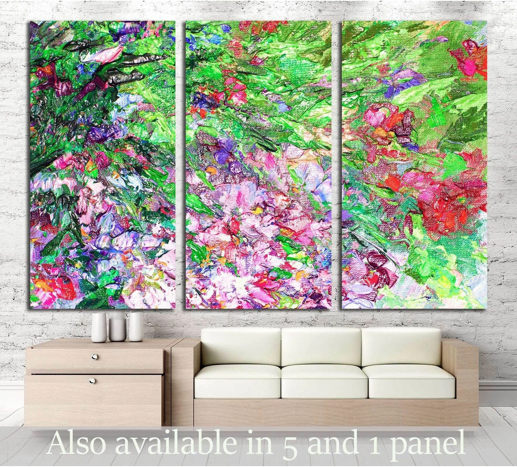 Impressionist floral triptych canvas print with green, pink, and purple garden brushwork above a sofa