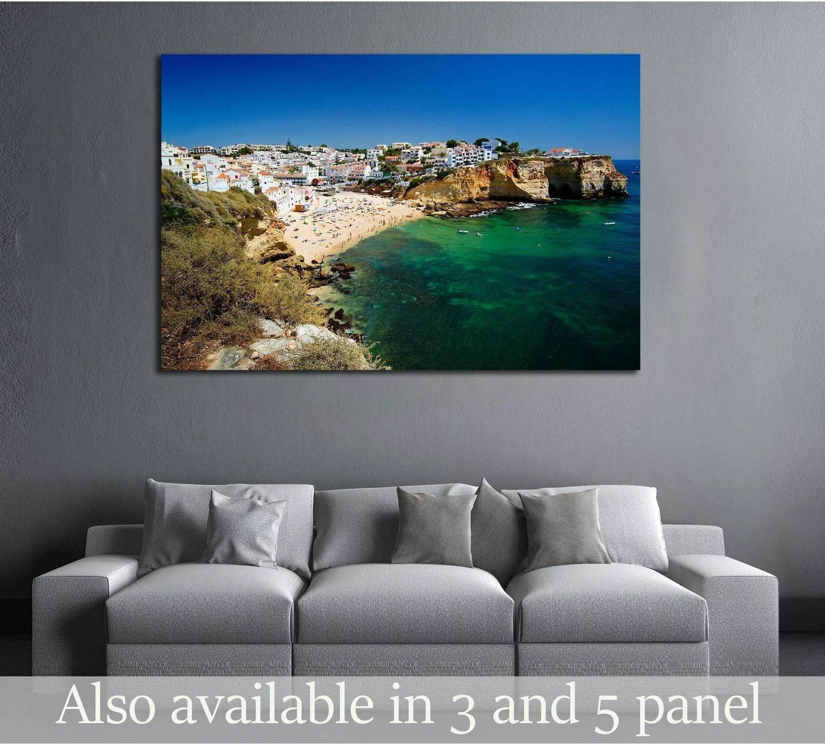 Carvoeiro Algarve canvas print with turquoise cove and cliffside village above a sofa