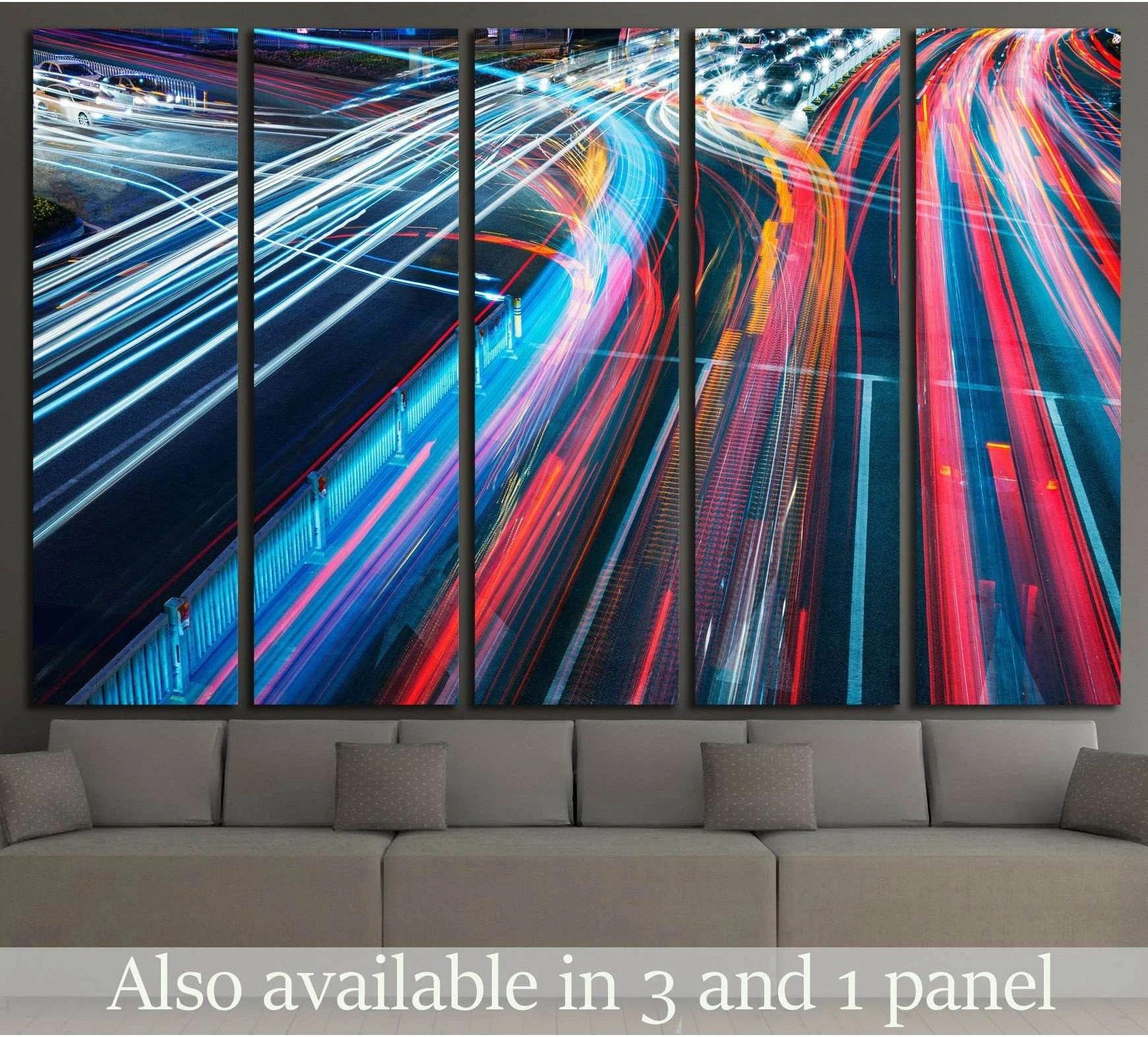 Multi-panel city light trails canvas print above sofa in a modern living room