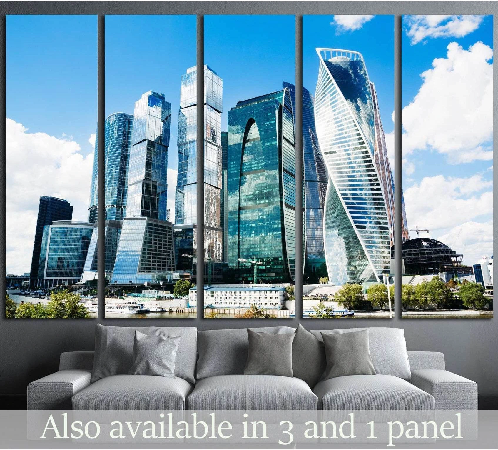 Moscow City skyline canvas print in five-panel mockup above sofa with blue skyscrapers and riverfront