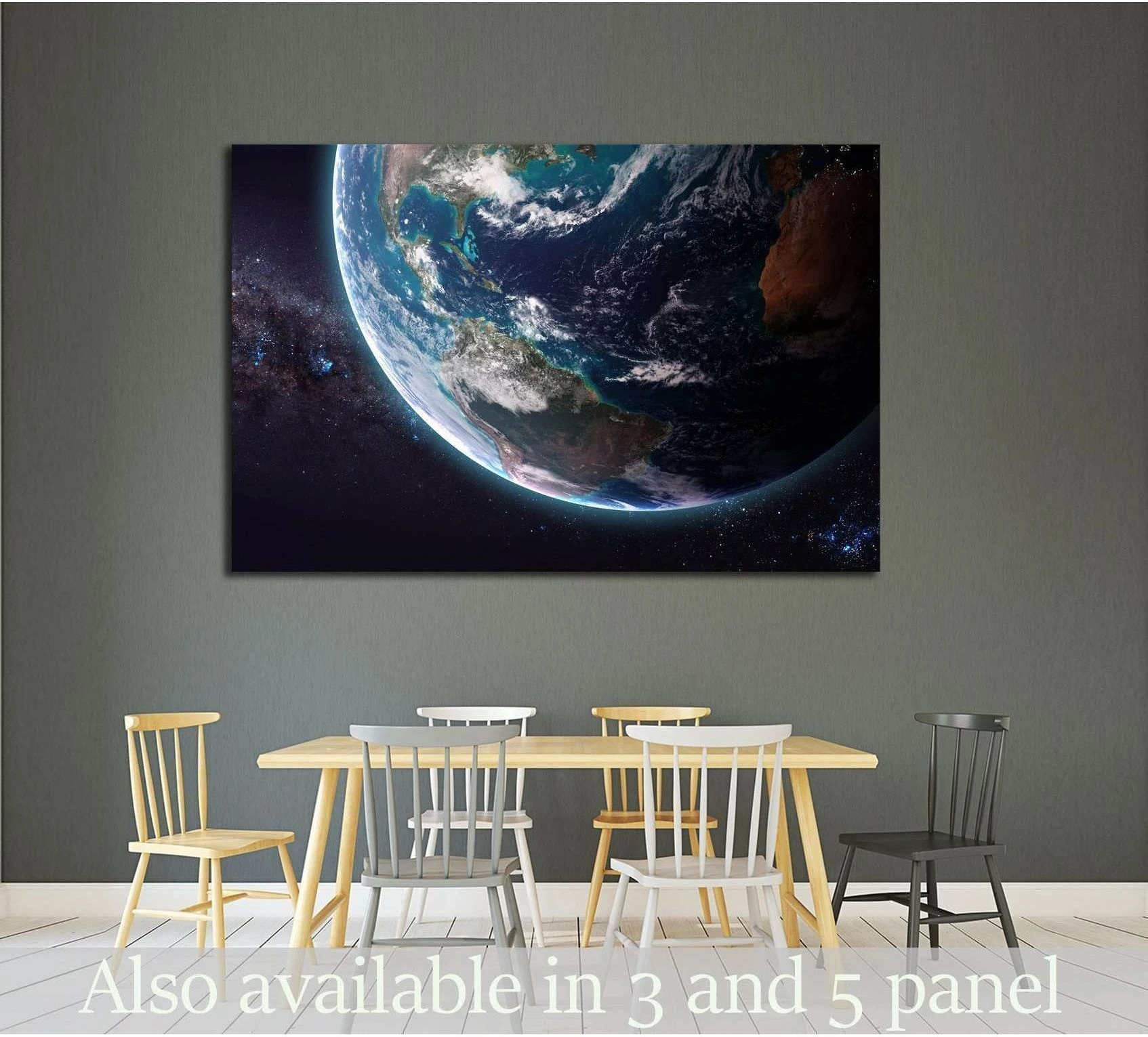 Earth from space canvas print above dining table in a modern room with deep blue oceans and stars