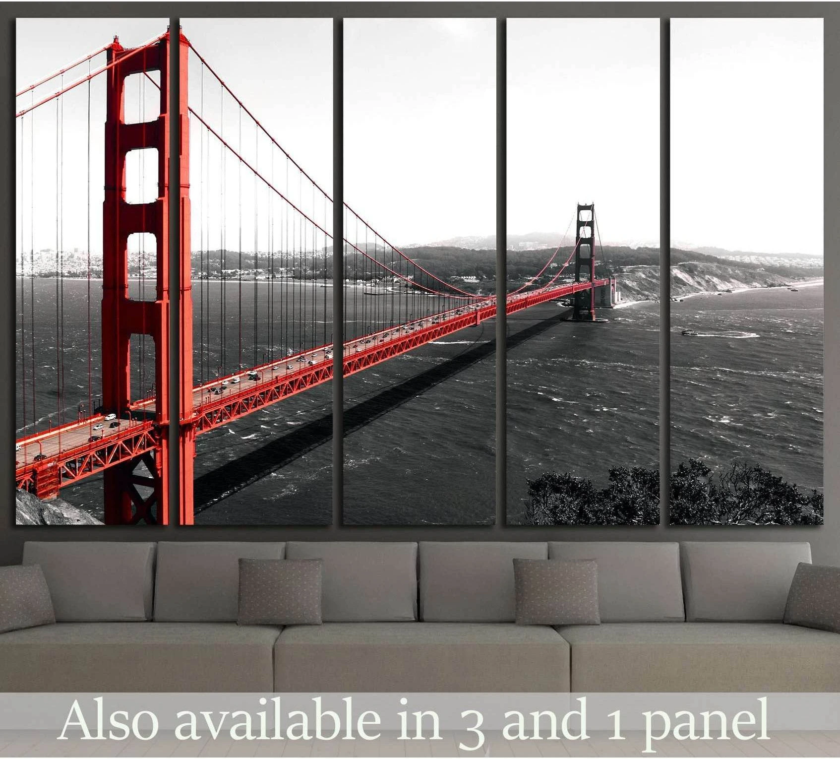 Golden Gate Bridge canvas print in red selective color over monochrome bay, displayed above sofa