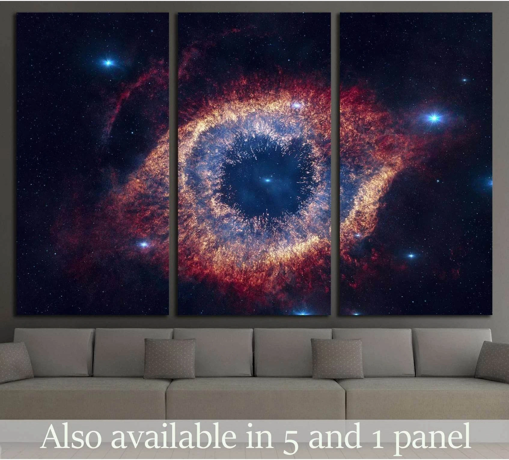 Helix Nebula triptych canvas print above a sofa with blue and orange cosmic ring in deep space