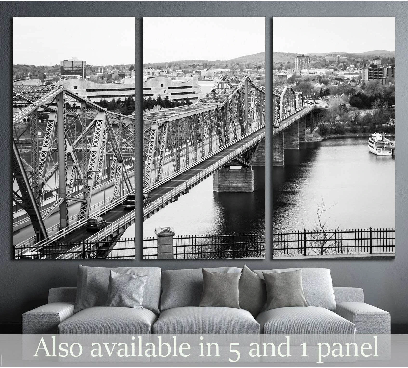Black and white Royal Alexandra Bridge Ottawa canvas print shown above a sofa in a modern living room
