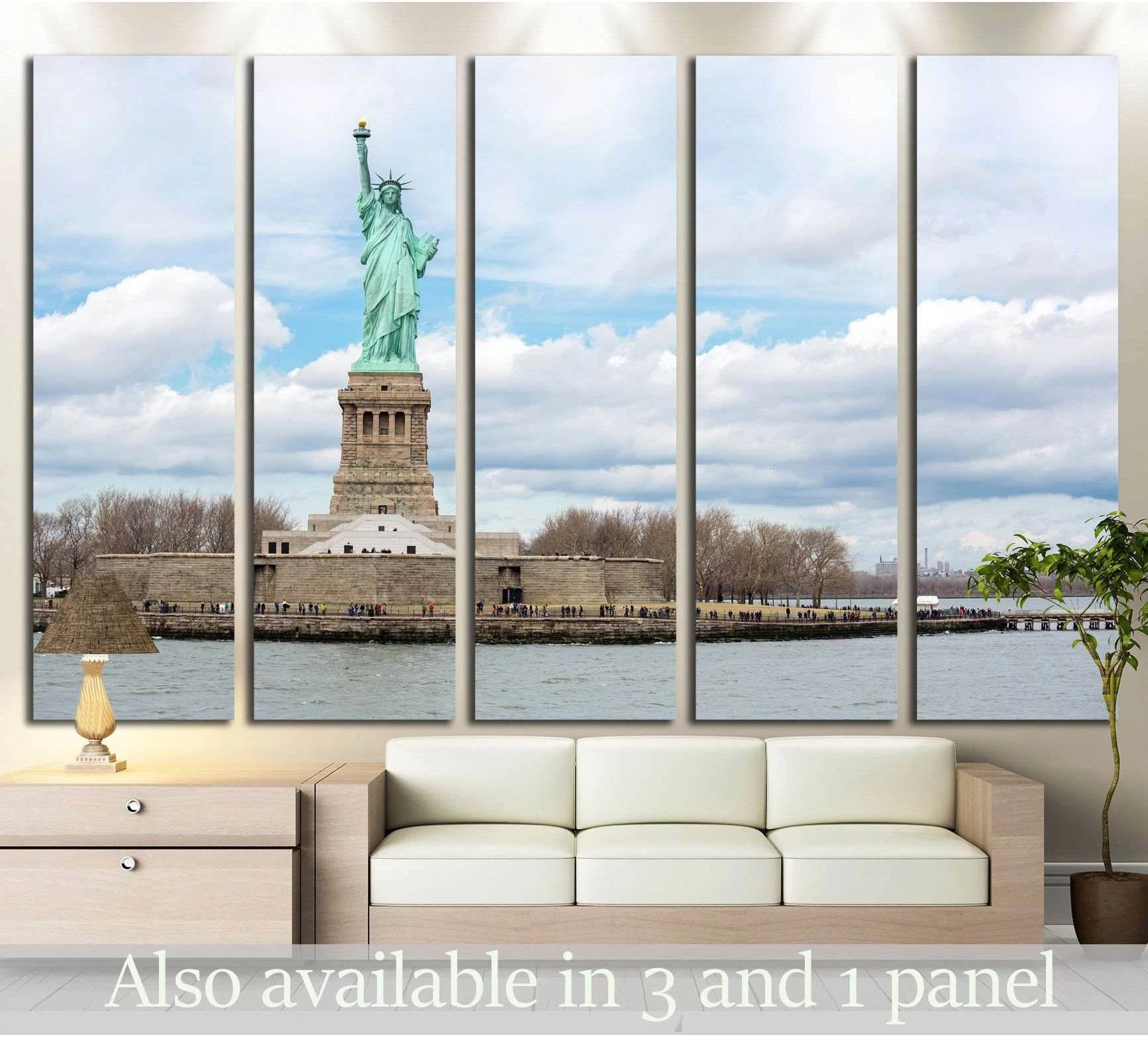 Statue of Liberty canvas print across New York Harbor displayed above a sofa in a modern living room