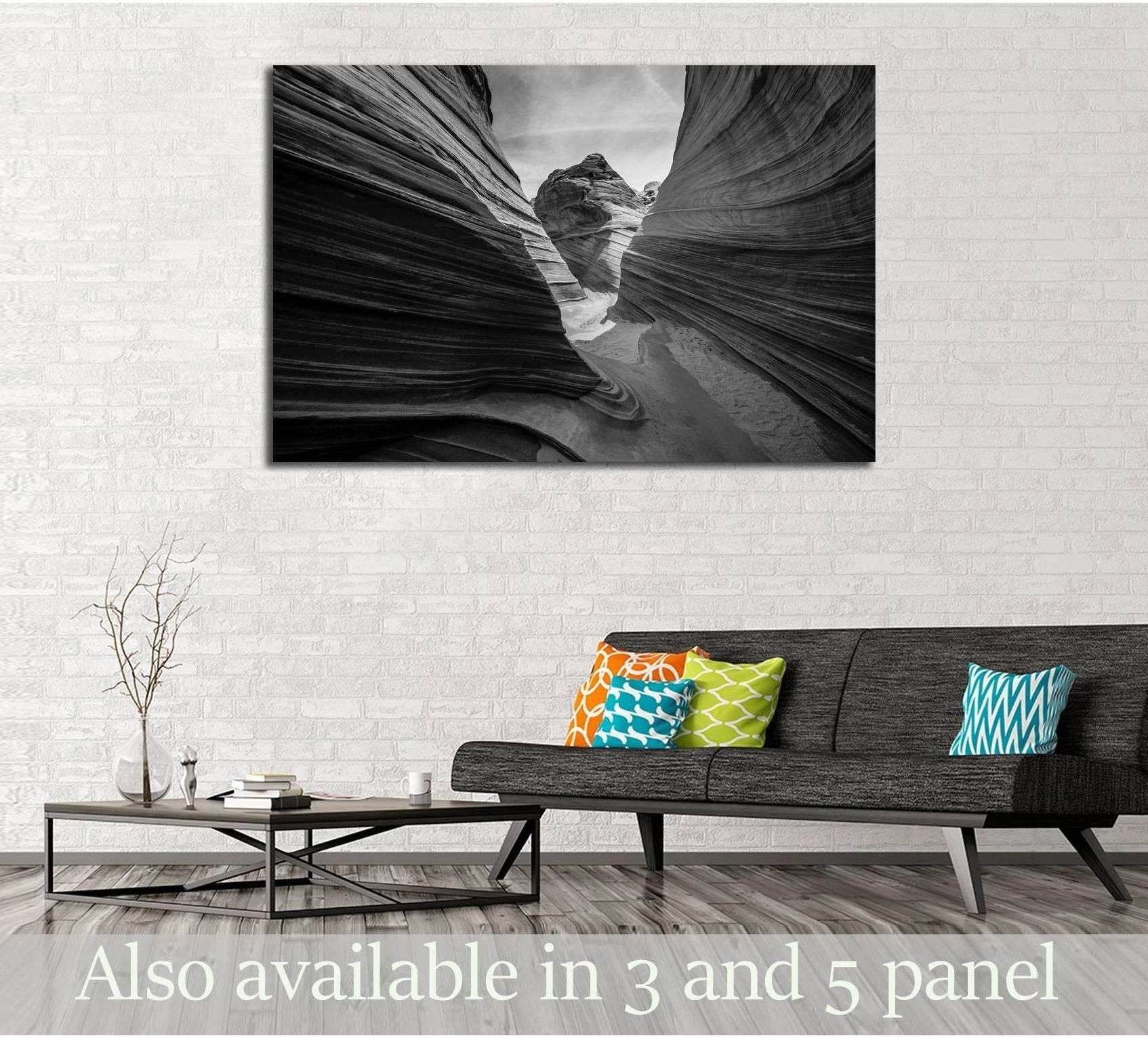Black and white Arizona slot canyon canvas print displayed above a sofa in a modern living room