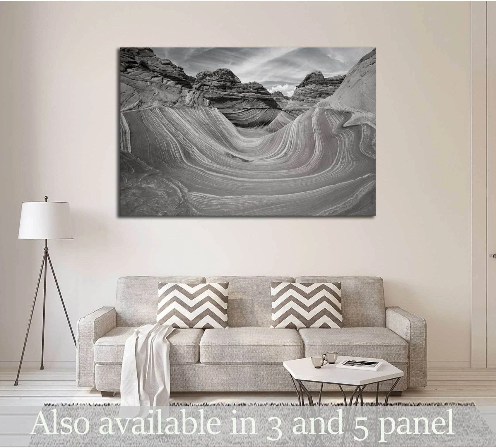 Black and white The Wave sandstone canvas print hung above a sofa in a neutral modern living room