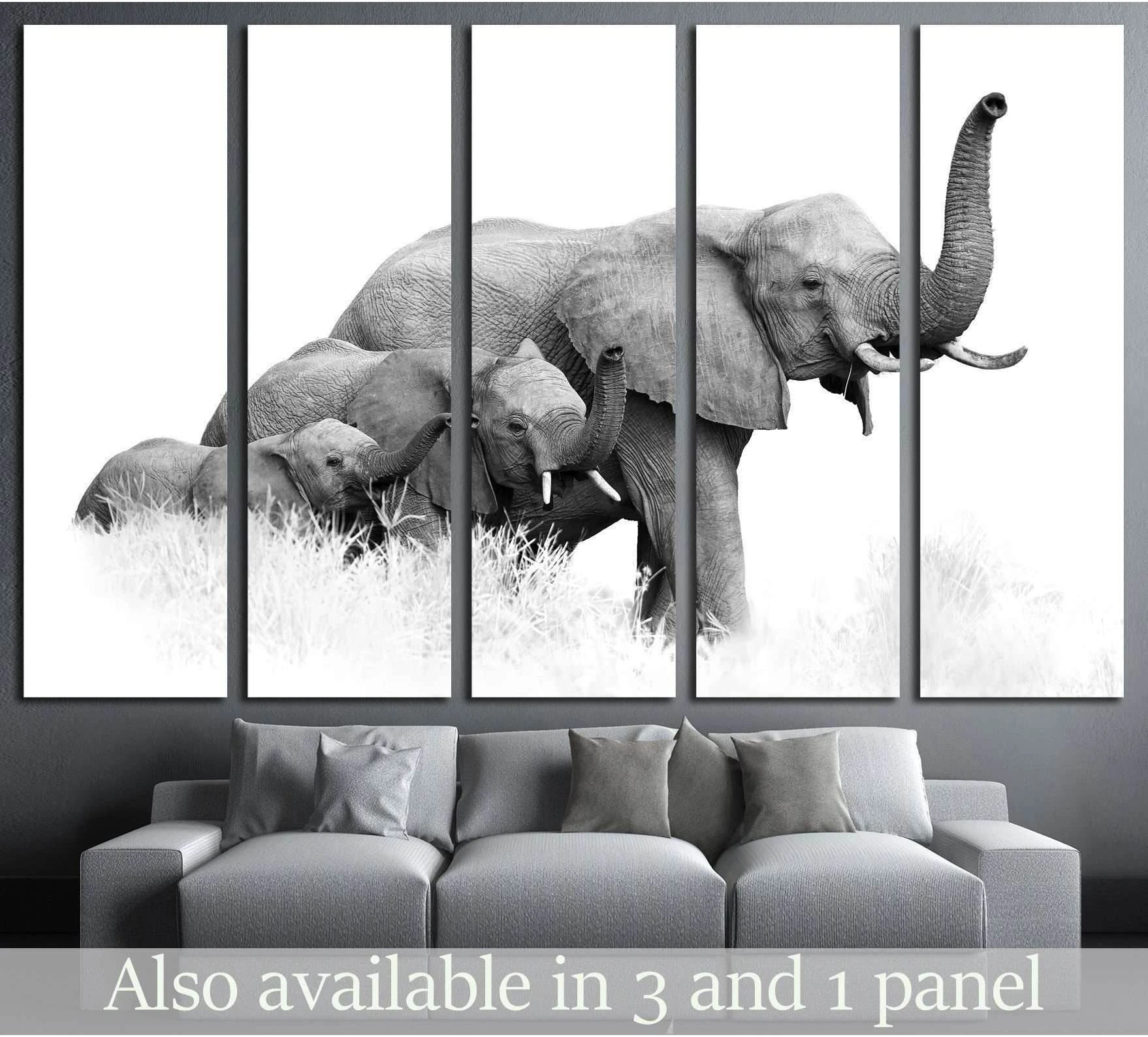 Black and white African elephant family canvas print in five-panel wall display above a gray sofa