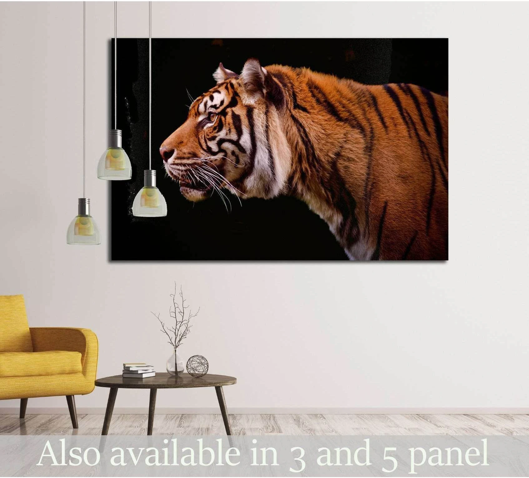 Tiger profile canvas print on a black background displayed above a sofa in a modern living room
