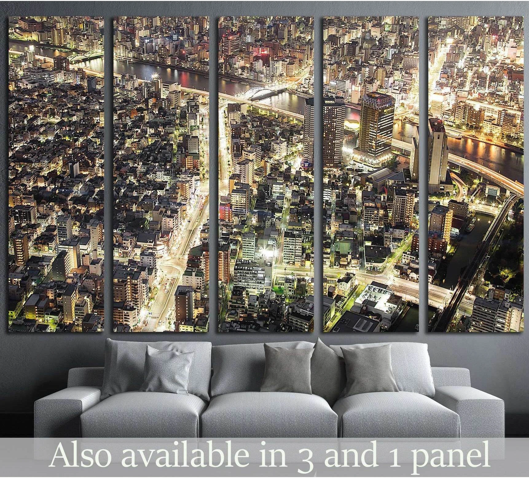 Tokyo night skyline canvas print in five panels above sofa in a modern living room
