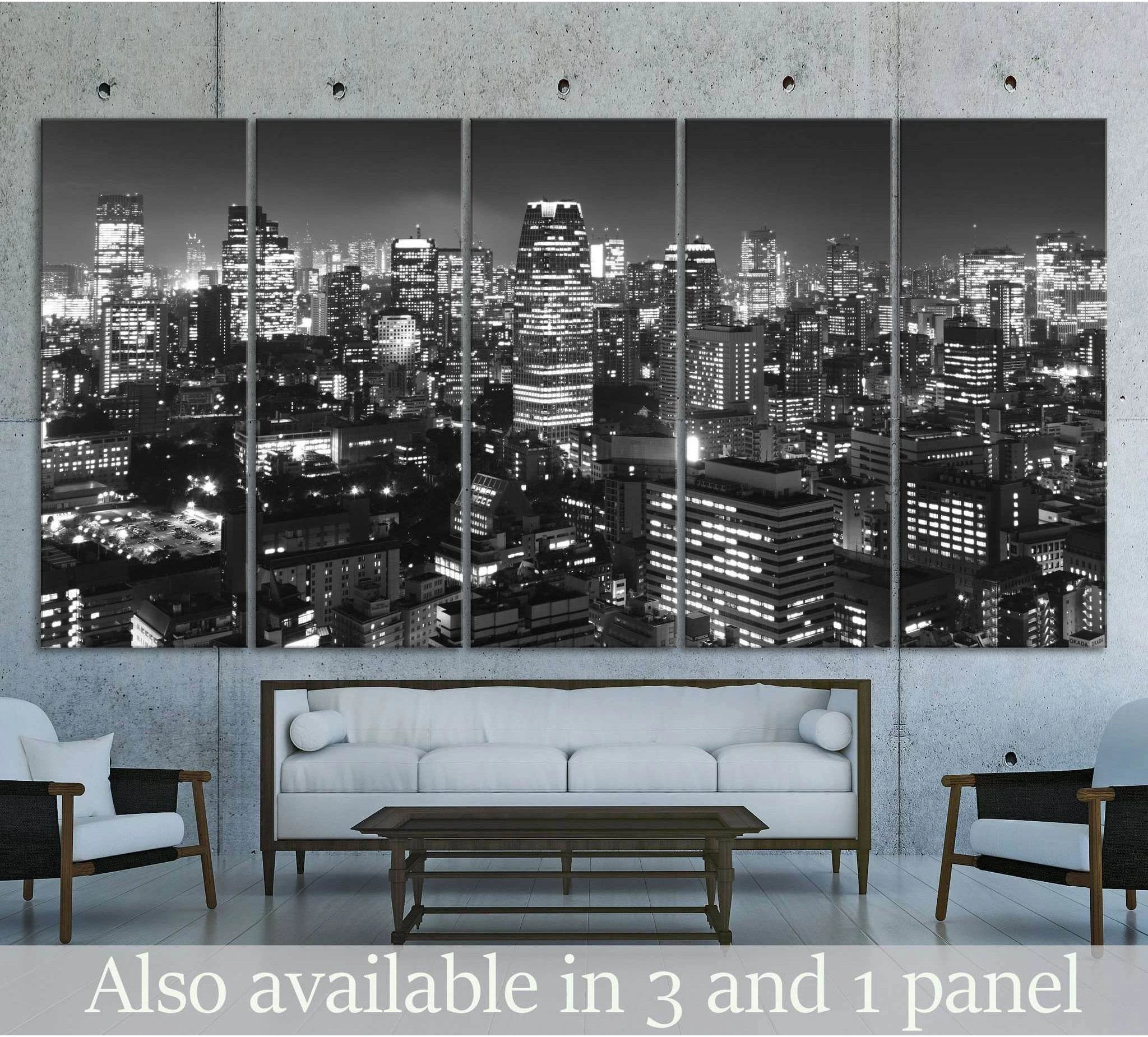 Black and white Tokyo skyline canvas print hung above a sofa in a modern living room