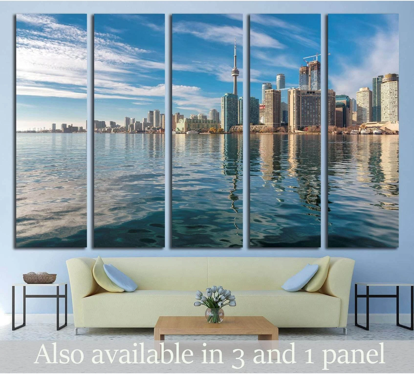 Toronto skyline canvas print with CN Tower and waterfront reflections above sofa in modern living room