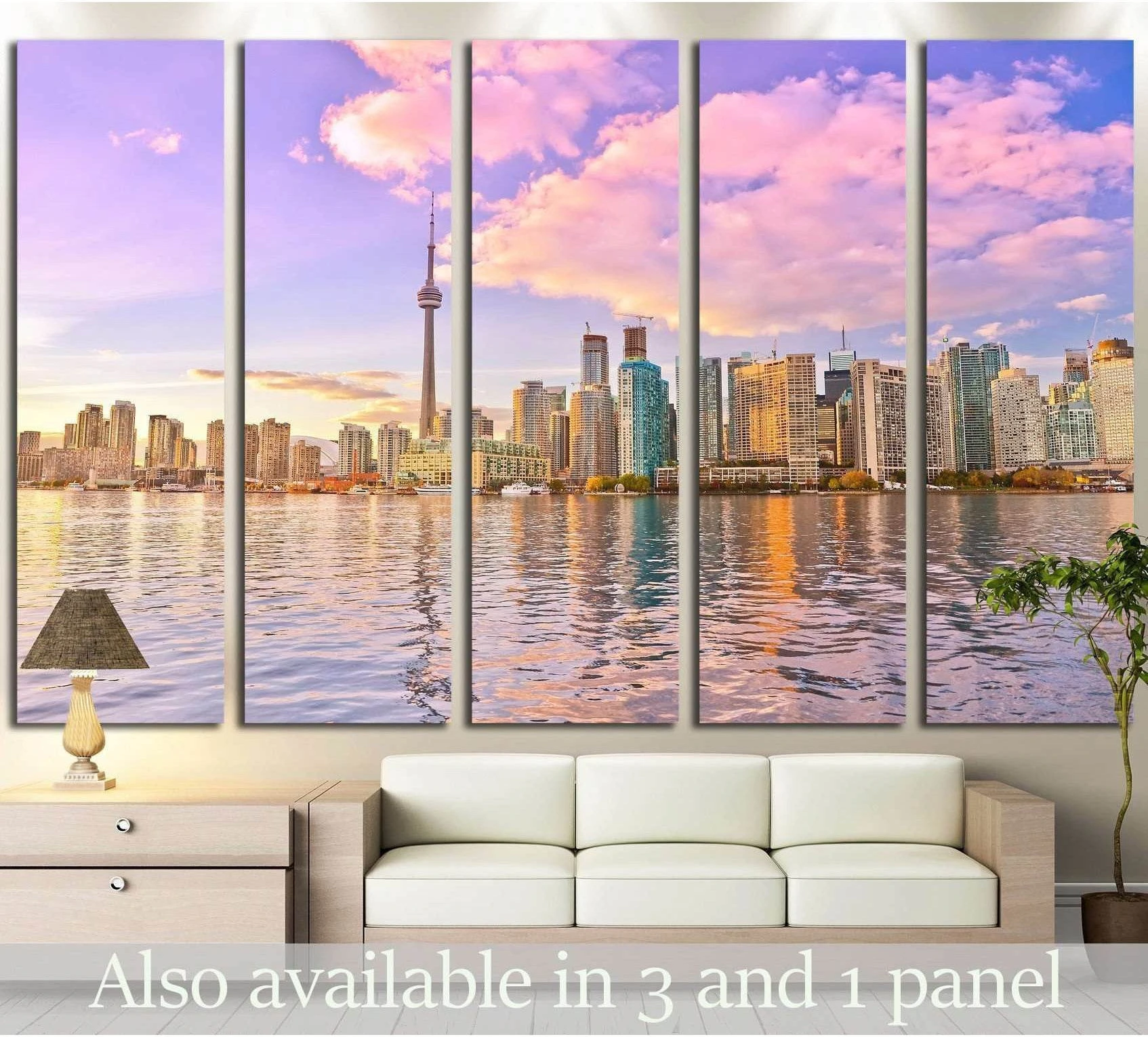 Toronto skyline canvas print with CN Tower at dusk above a sofa in a modern living room