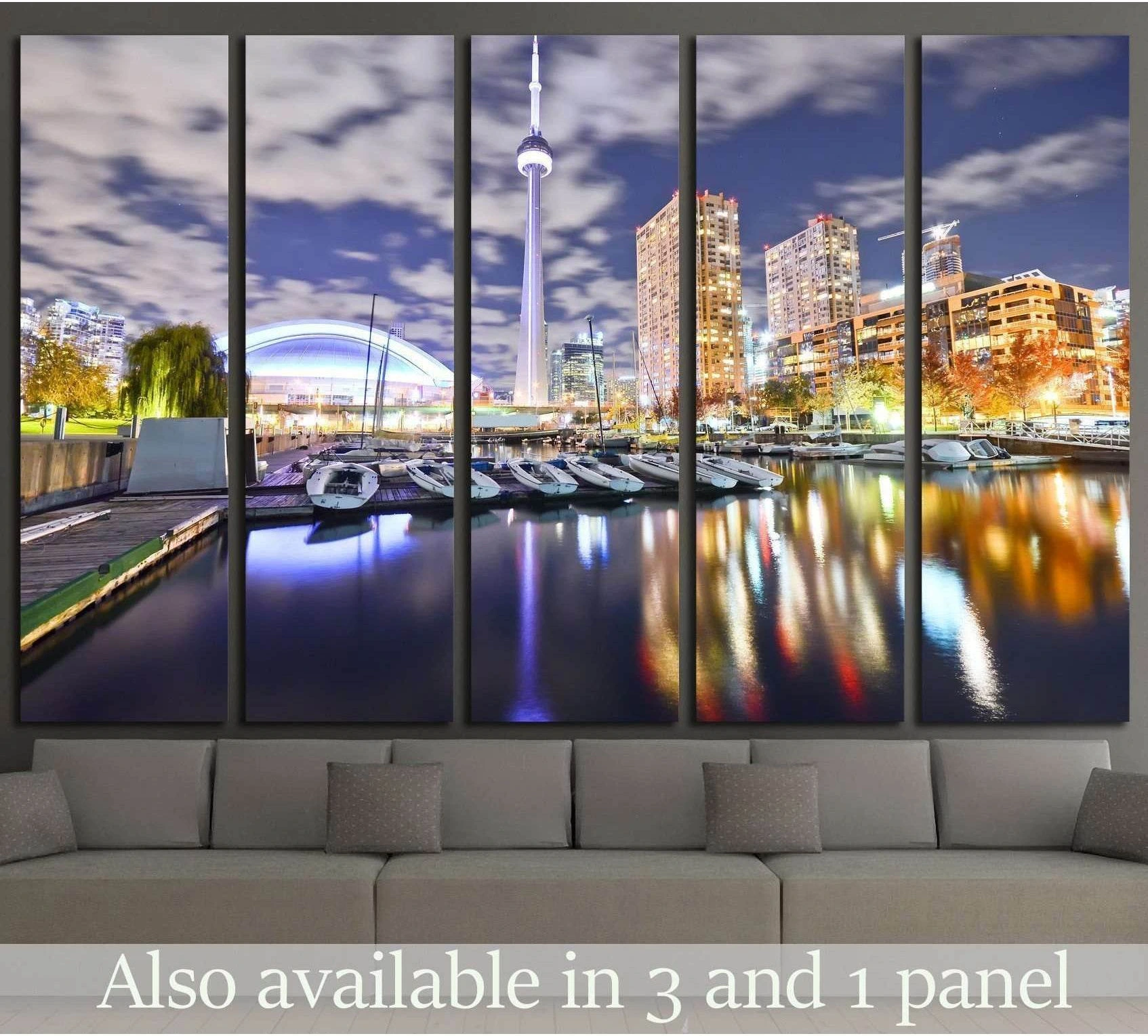 Toronto skyline canvas print with CN Tower and marina reflections above sofa in modern living room