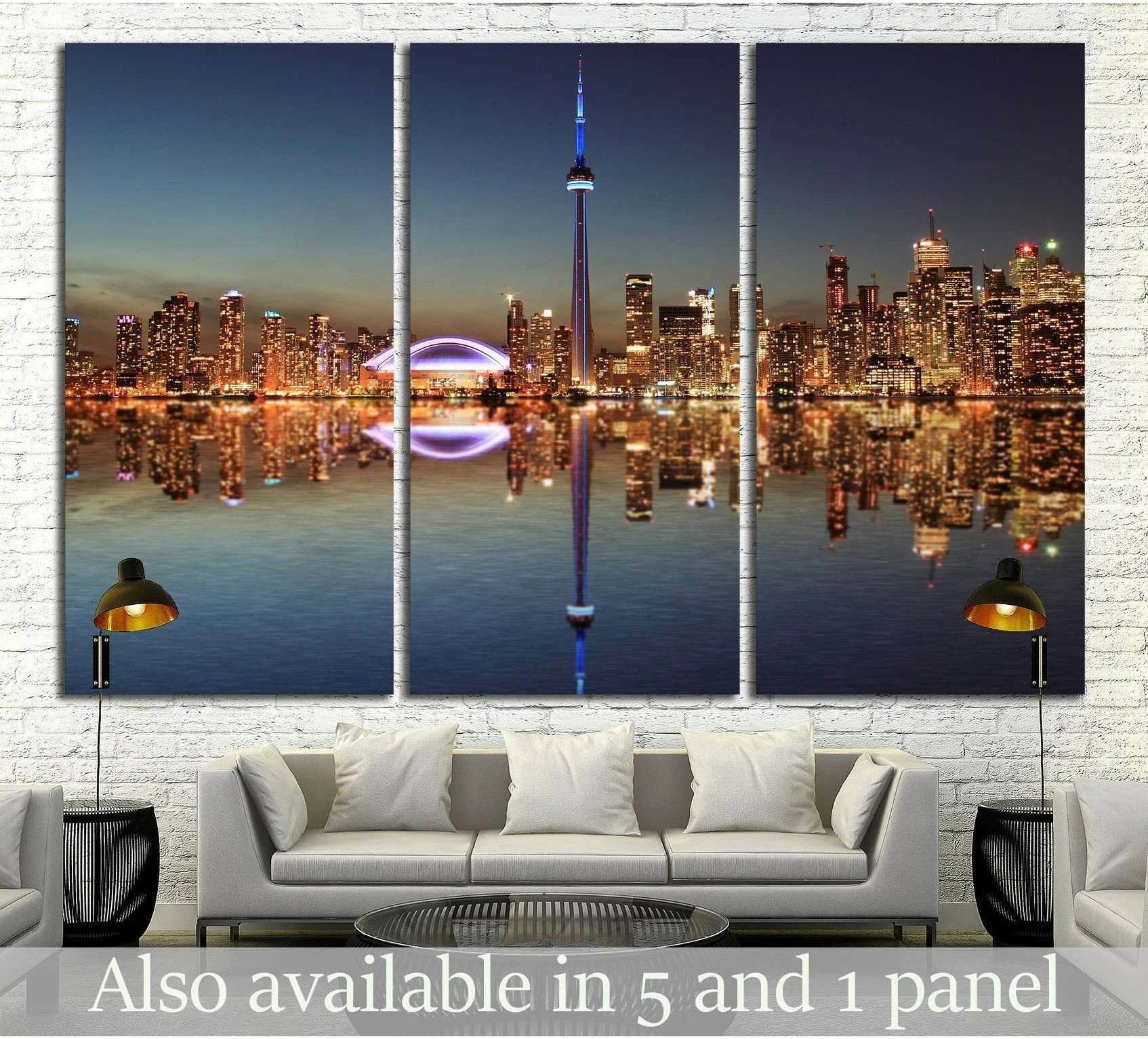 Toronto skyline canvas print with CN Tower and Lake Ontario reflections above a sofa