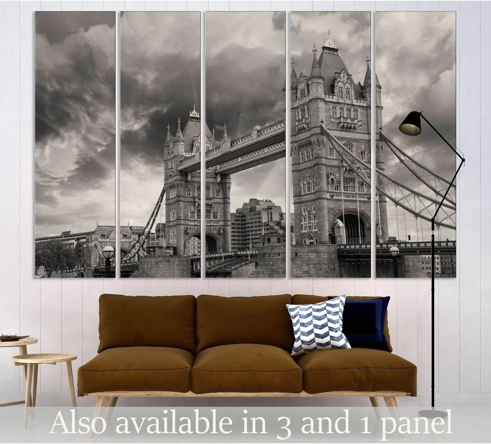 Black and white Tower Bridge canvas print in a five-panel layout above a sofa in a modern living room