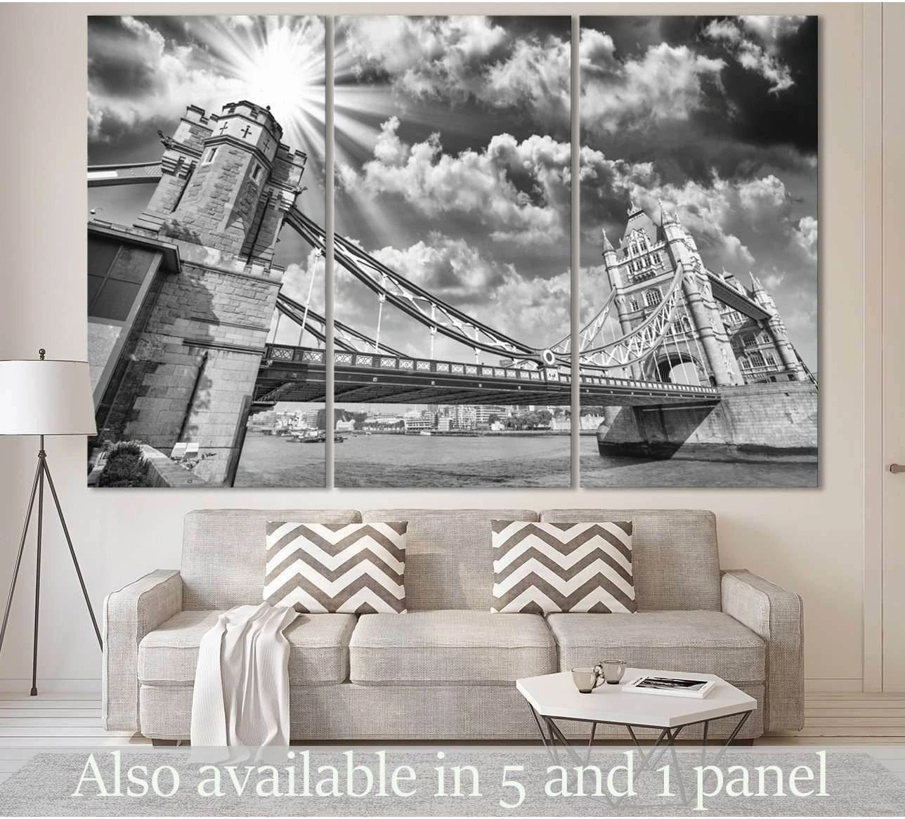 Black and white Tower Bridge canvas print hung above a sofa in a modern living room