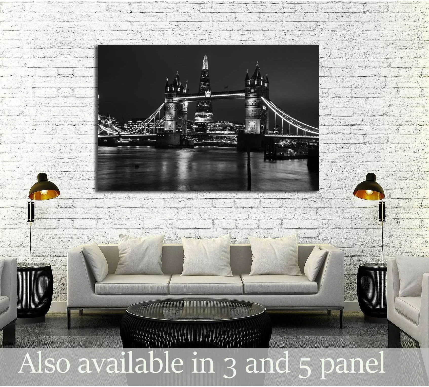 Black and white Tower Bridge London canvas print displayed above a sofa in a modern living room