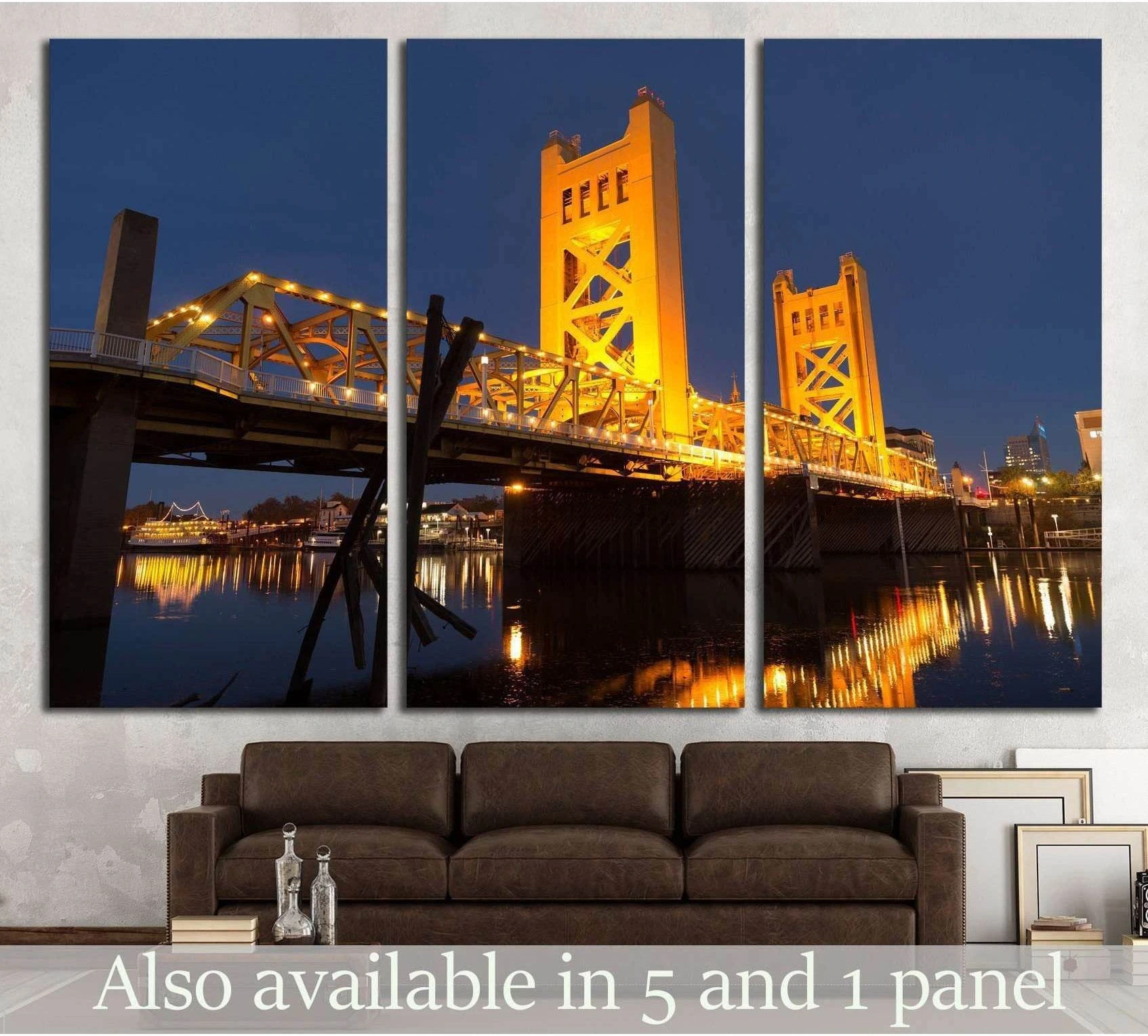 Sacramento Tower Bridge canvas print glowing above the river at night in a triptych living room mockup
