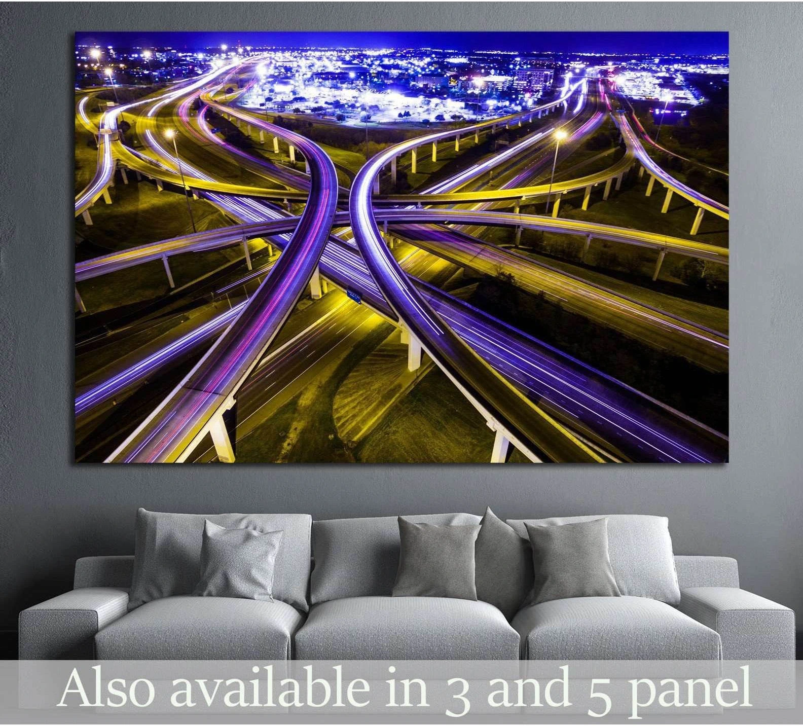 Aerial highway interchange canvas print with purple and gold light trails above a sofa