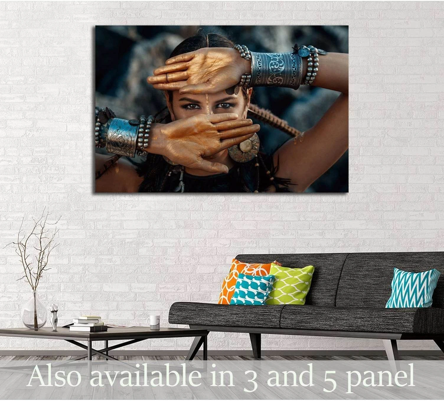 Tribal woman canvas print with gold-painted hands and silver jewelry above a sofa in a modern living room