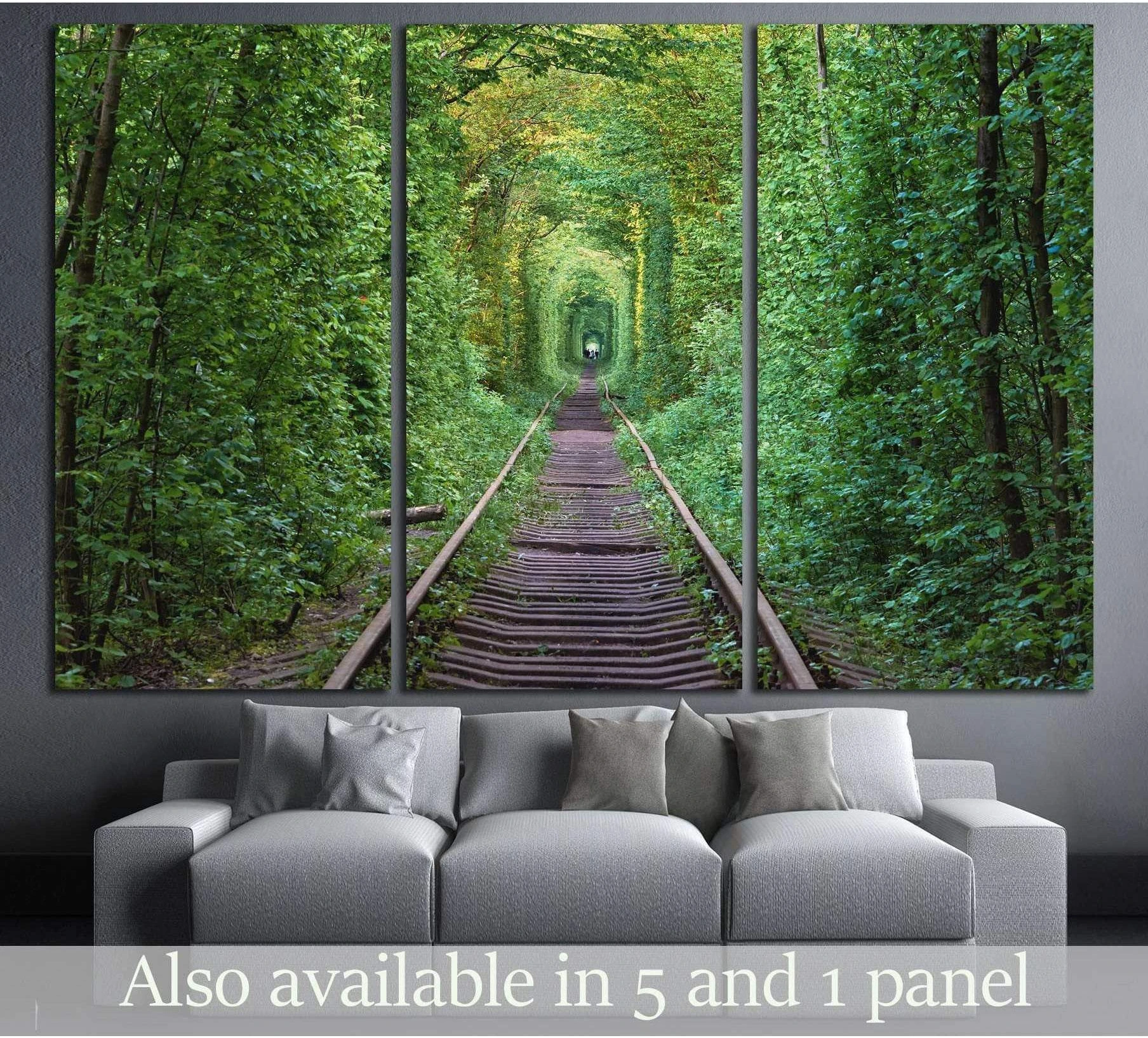 Triptych Tunnel of Love canvas print with railway tracks through a green forest arch above a gray sofa