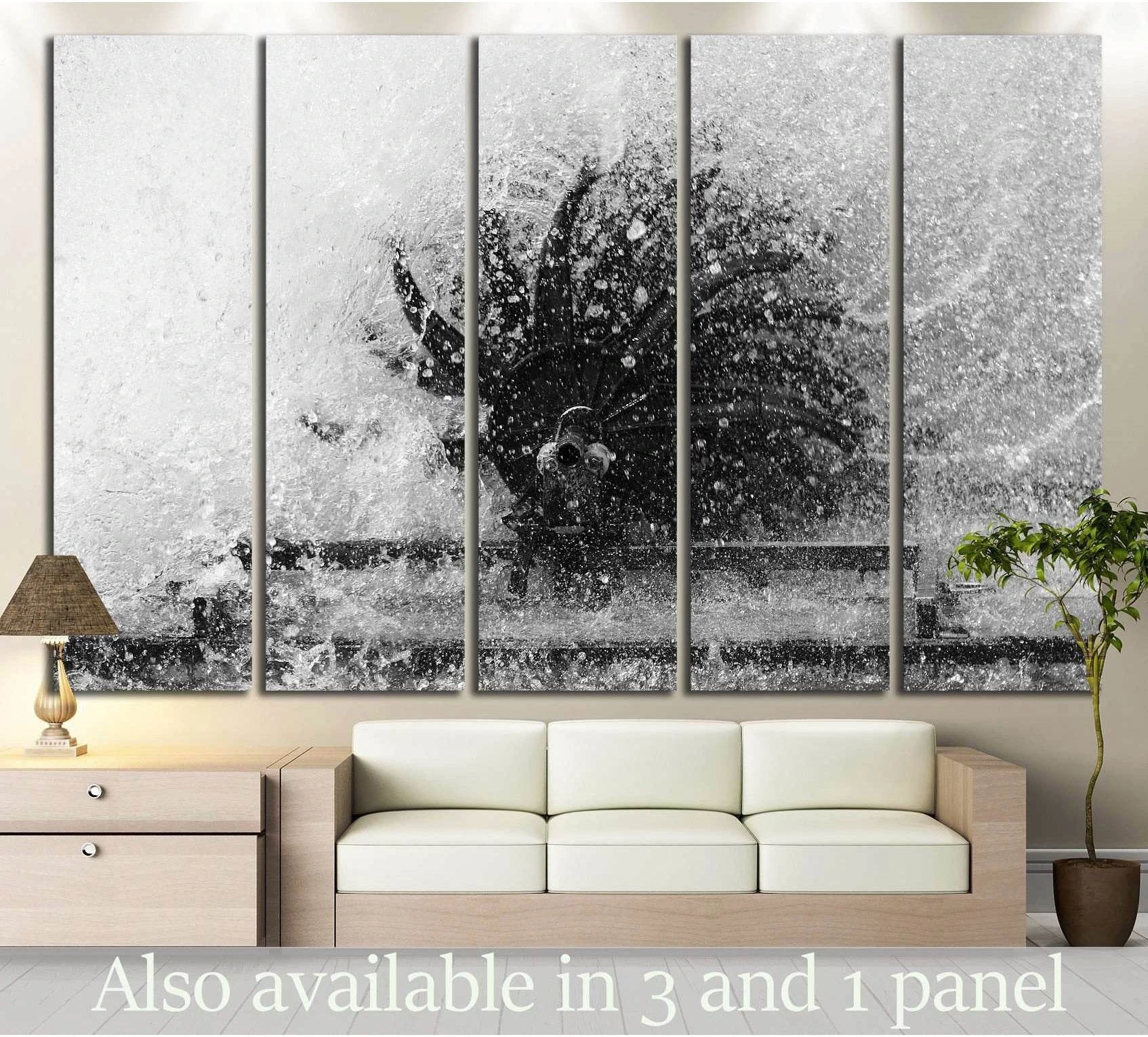 Black and white turbine canvas print with explosive water spray, shown as multi-panel wall art above a sofa