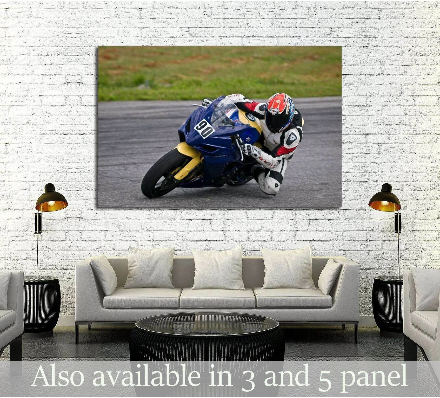 Motorcycle racing canvas print with blue and yellow sportbike rider above sofa in modern living room