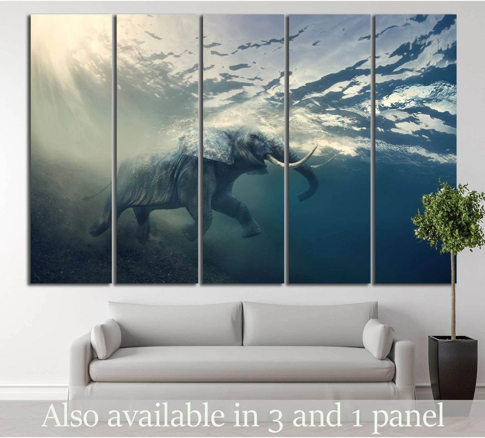 Underwater elephant canvas print in blue ocean tones hung above a sofa in a modern living room