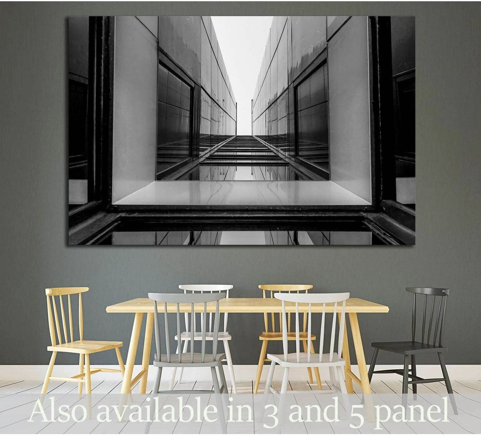 Black and white glass building canvas print with symmetrical architectural lines above dining table