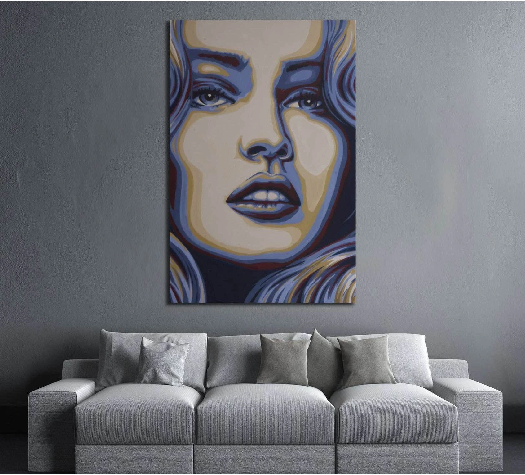 Blue beige woman portrait canvas print hung above a gray sofa in a modern living room