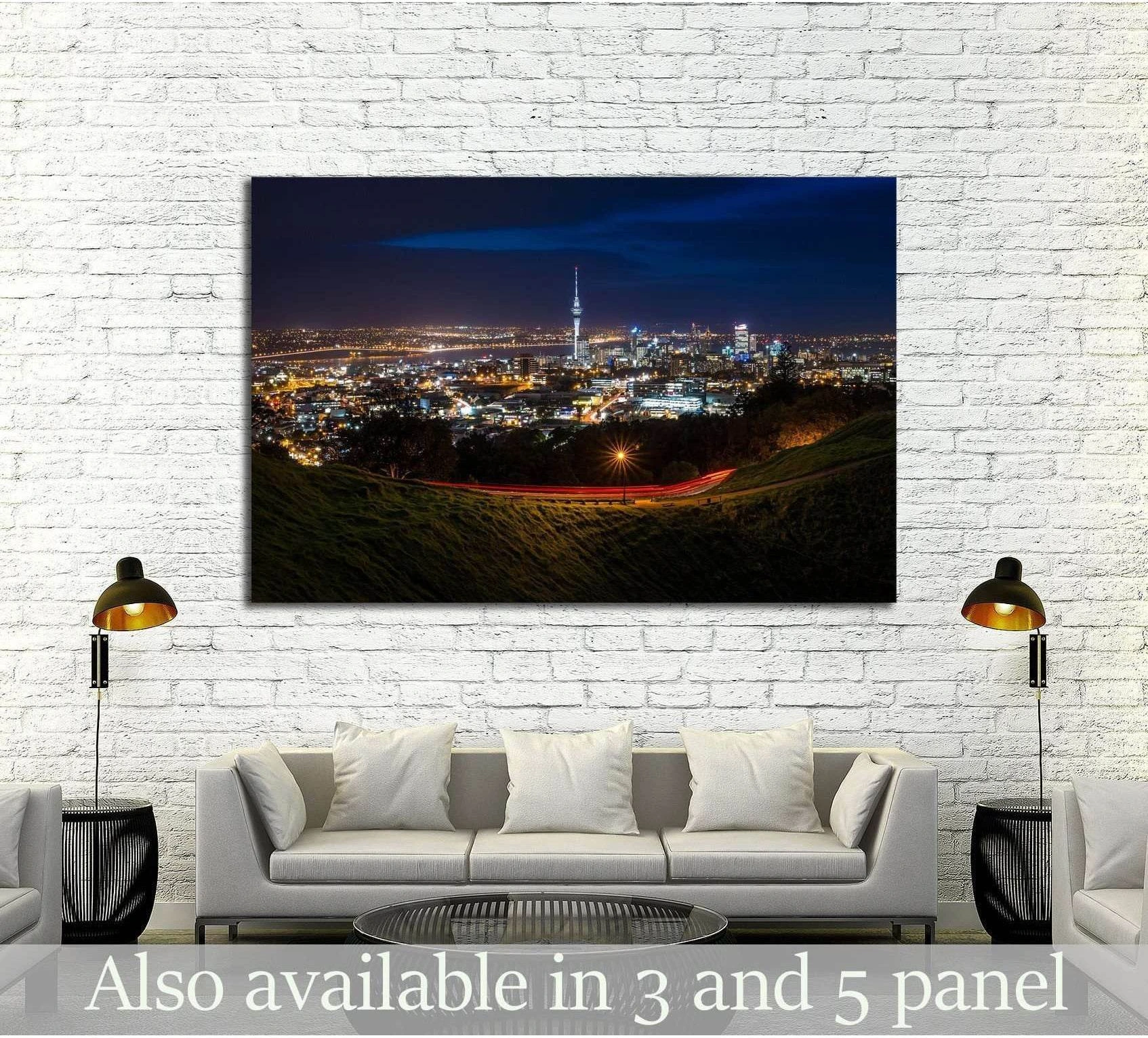 Auckland night skyline canvas print from Mt Eden with Sky Tower and city lights above a sofa