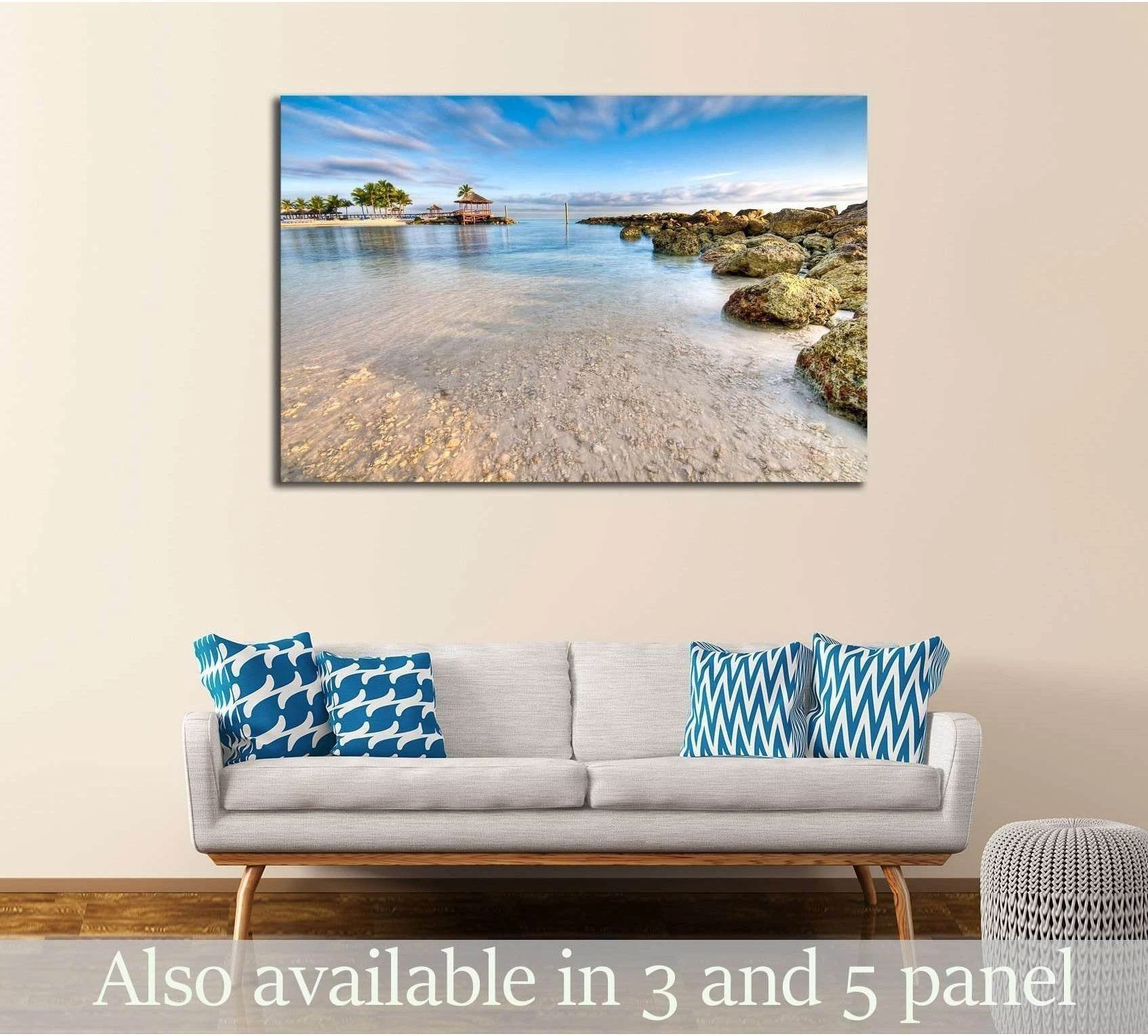 Nassau beach canvas print with turquoise water and rocky shore above sofa in coastal living room
