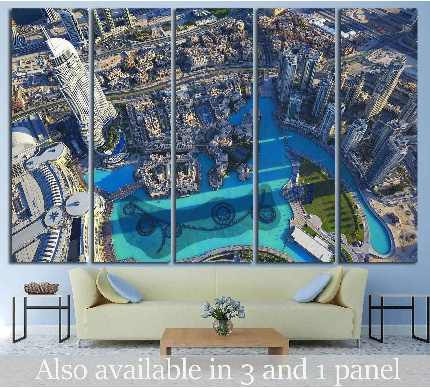 Dubai aerial canvas print with downtown skyscrapers and turquoise fountain pools above a sofa