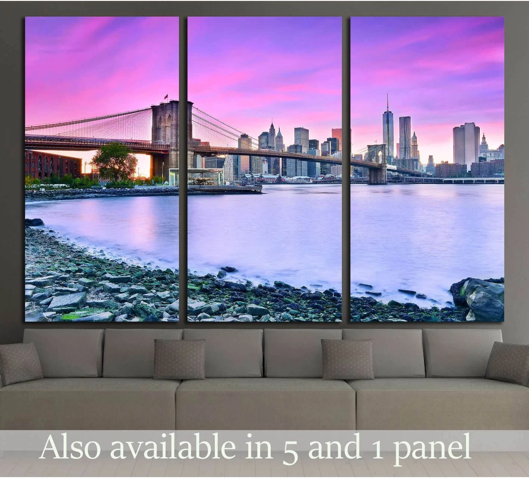 Brooklyn Bridge and New York skyline triptych canvas print at pink purple dusk above a sofa