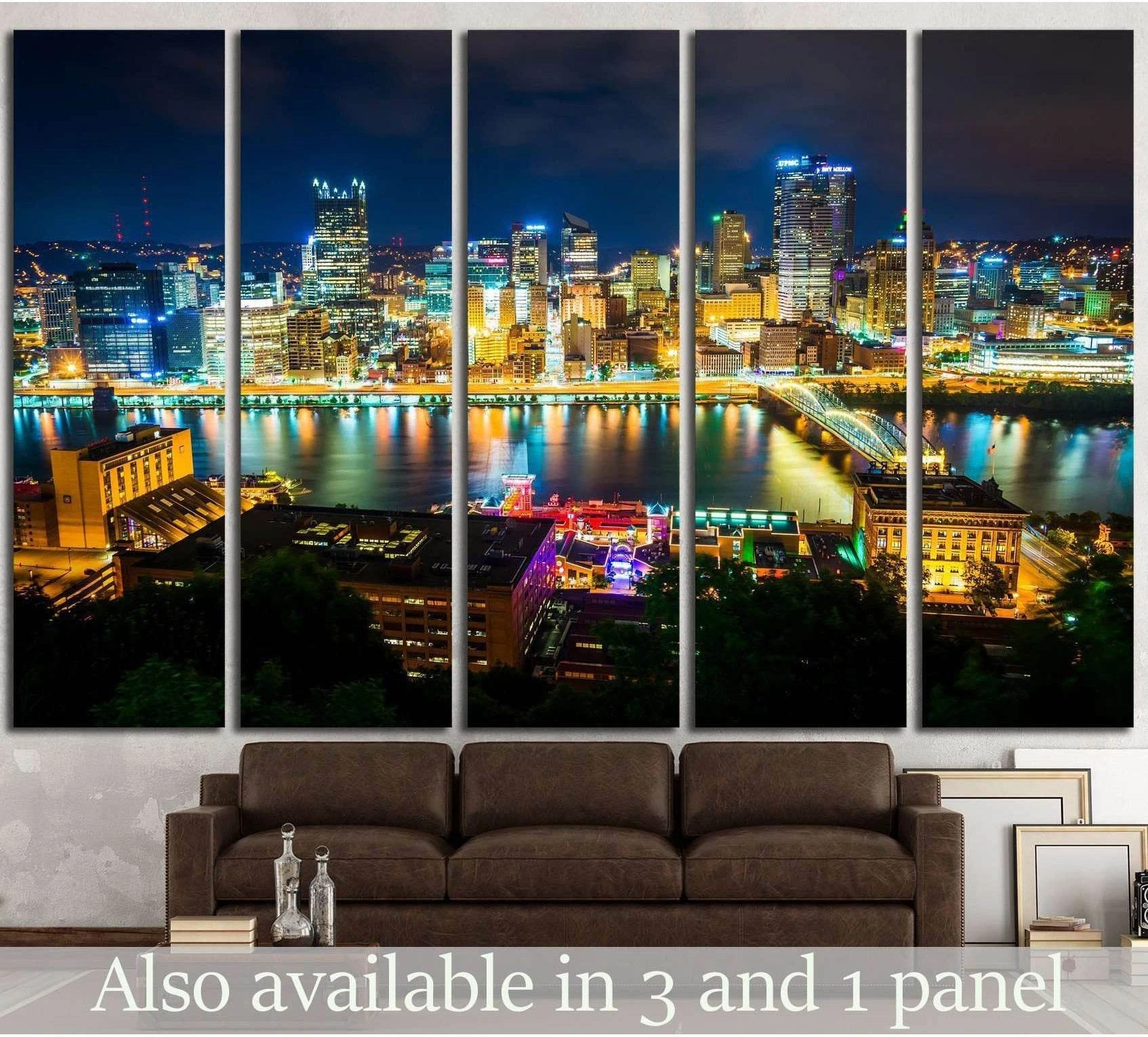 Pittsburgh skyline canvas print at night above a sofa with glowing bridges and river reflections