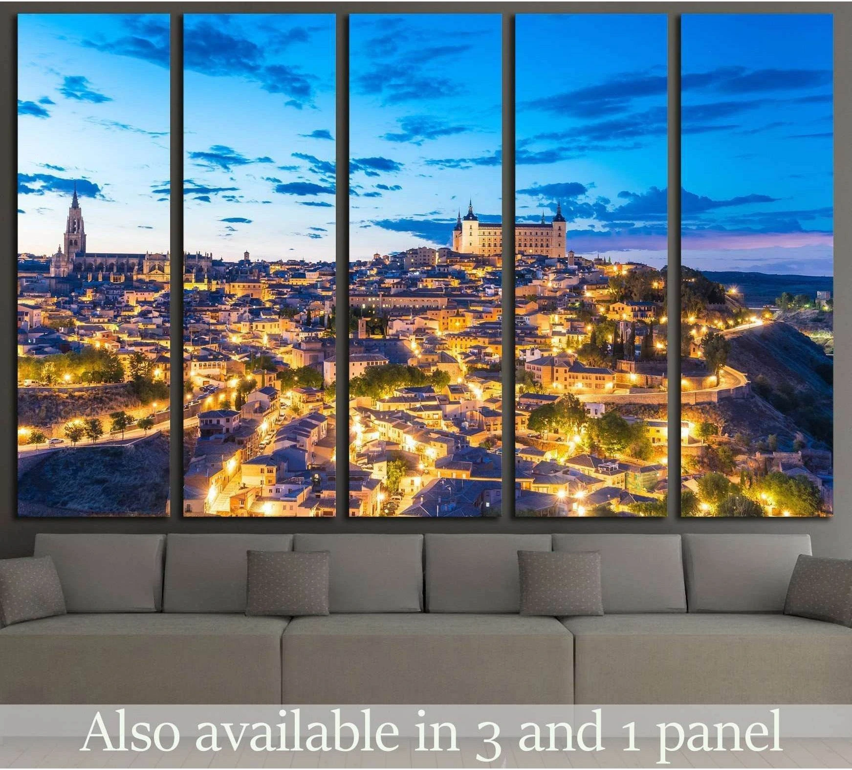 Toledo Spain canvas print with Alcázar and cathedral at dusk above a sofa in a modern living room